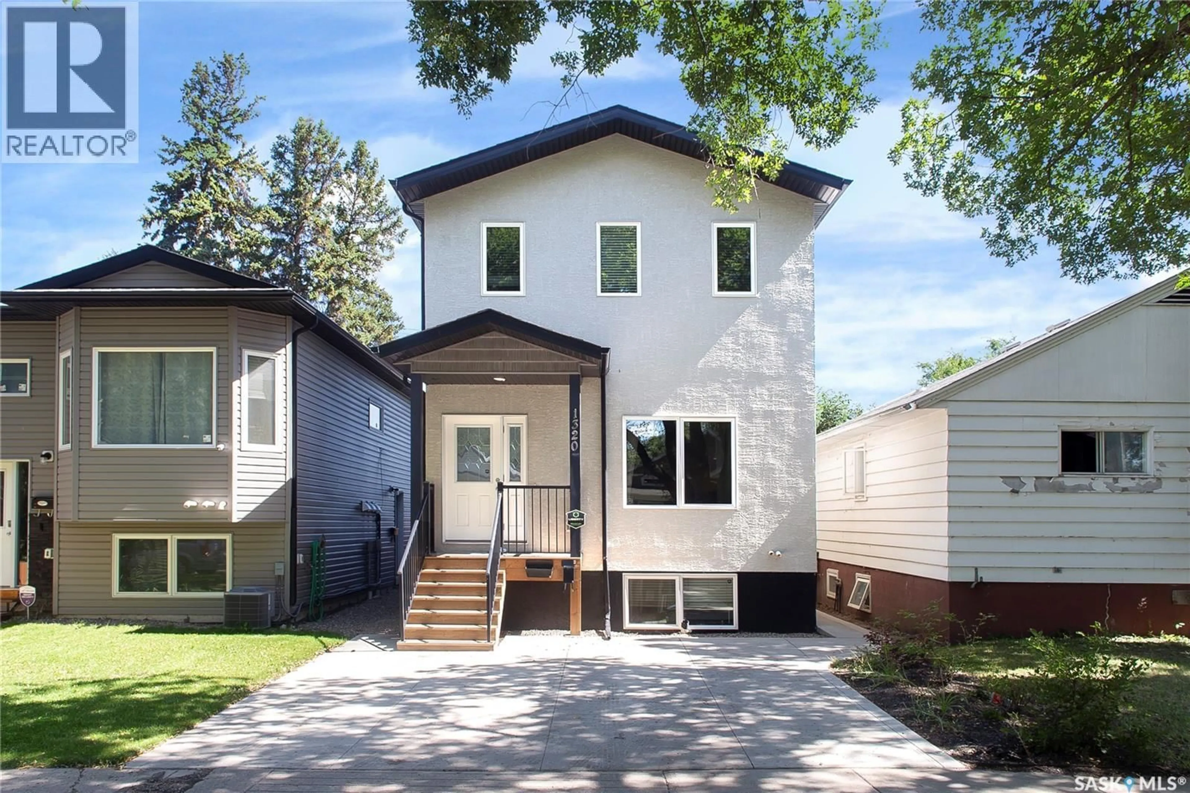 Home with vinyl exterior material, street for 1320 B AVENUE, Saskatoon Saskatchewan S7L1G5