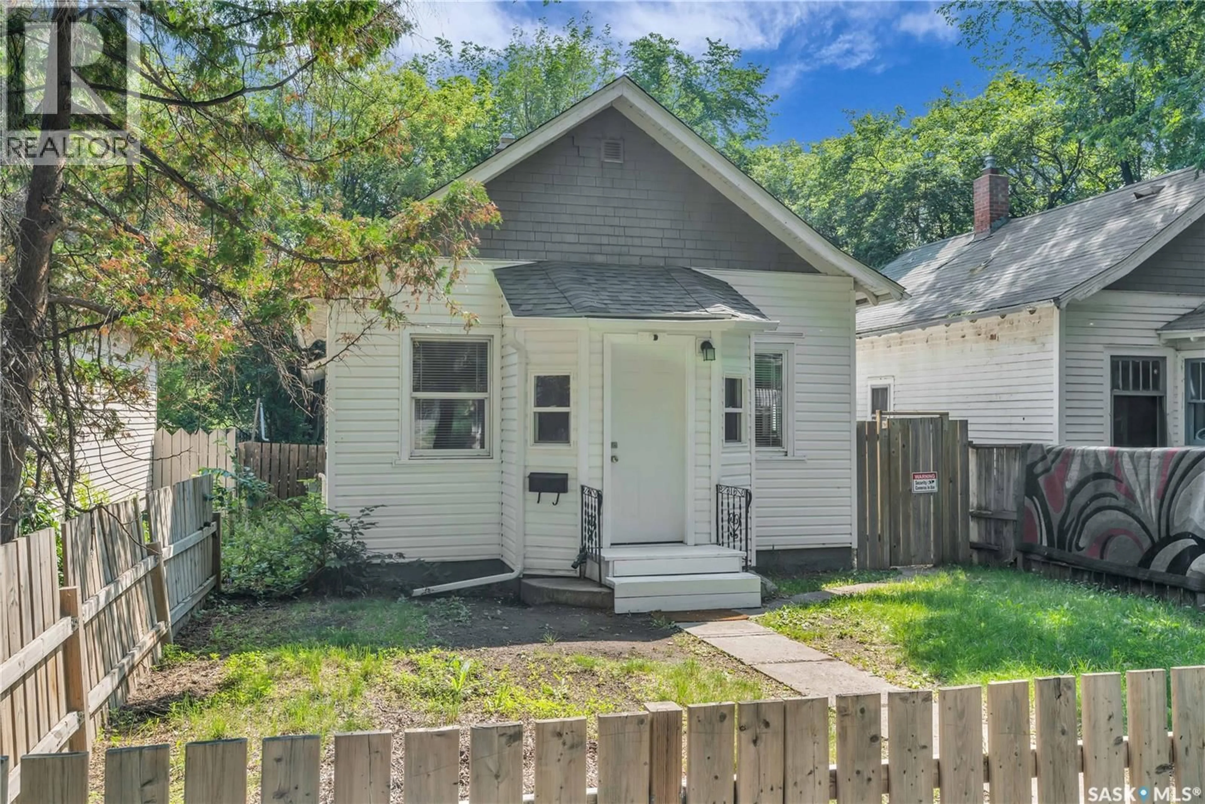 Home with vinyl exterior material, street for 120 O AVENUE, Saskatoon Saskatchewan S7M2R5