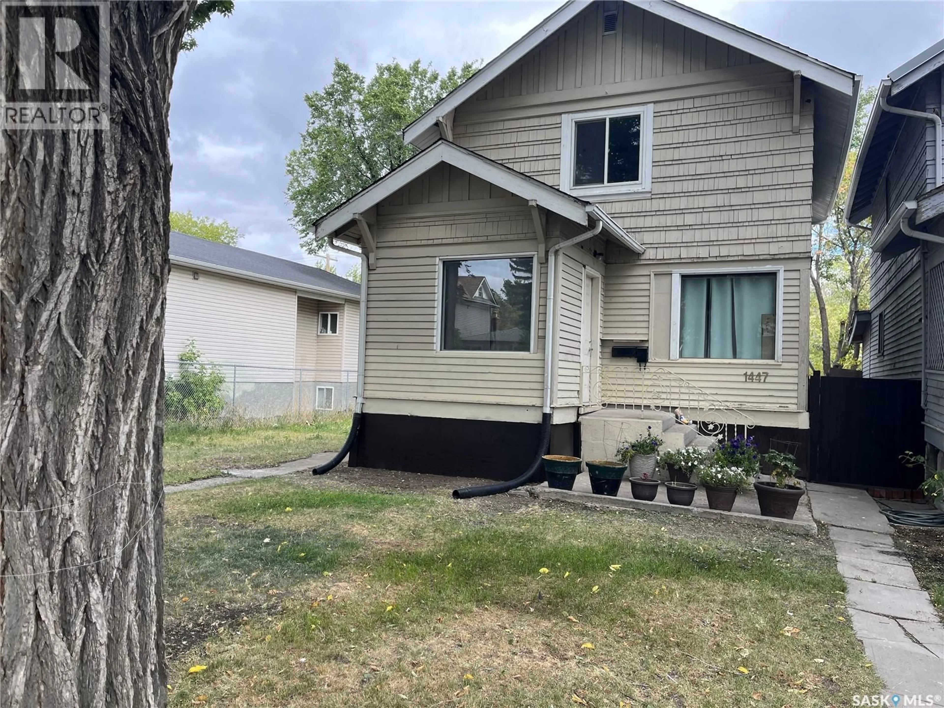 Home with vinyl exterior material, street for 1447 ROBINSON STREET, Regina Saskatchewan S4T2N7