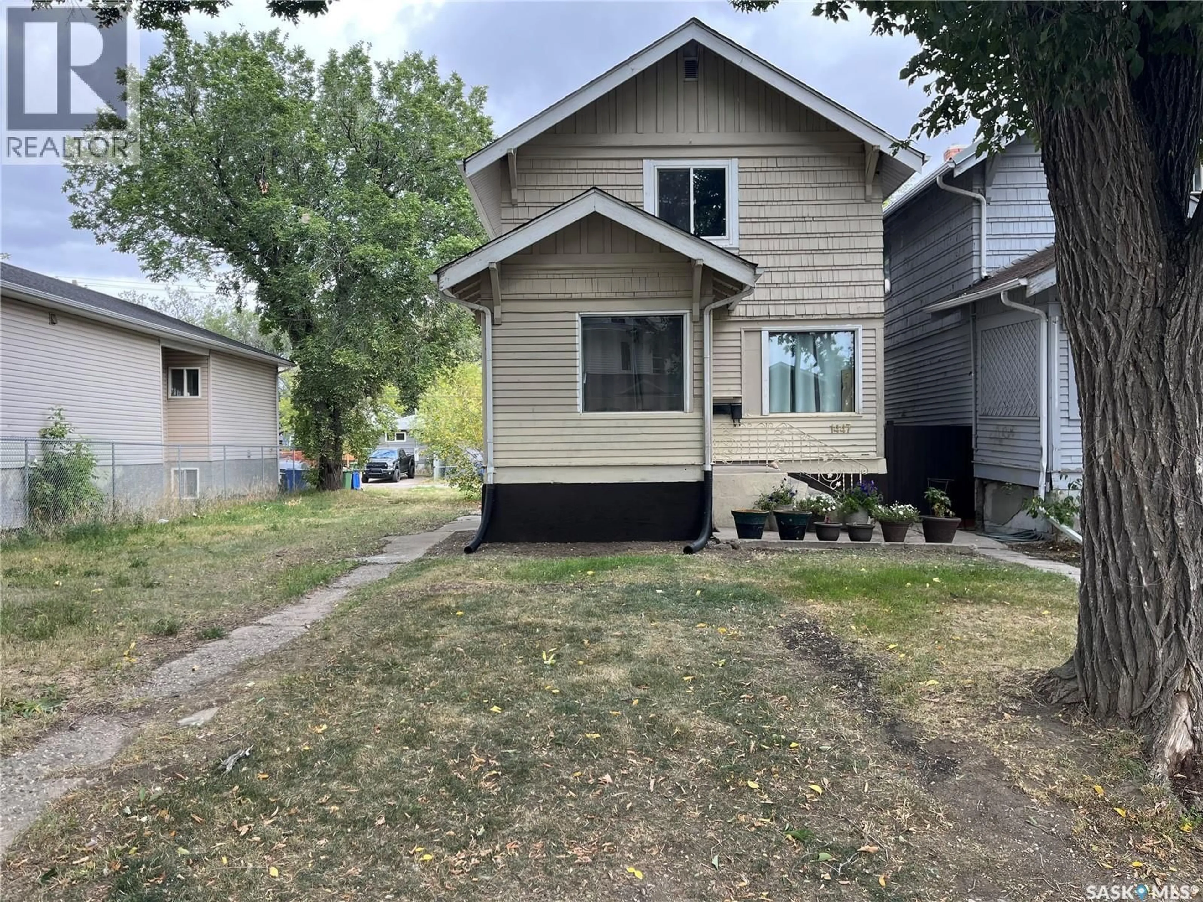Home with vinyl exterior material, street for 1447 ROBINSON STREET, Regina Saskatchewan S4T2N7