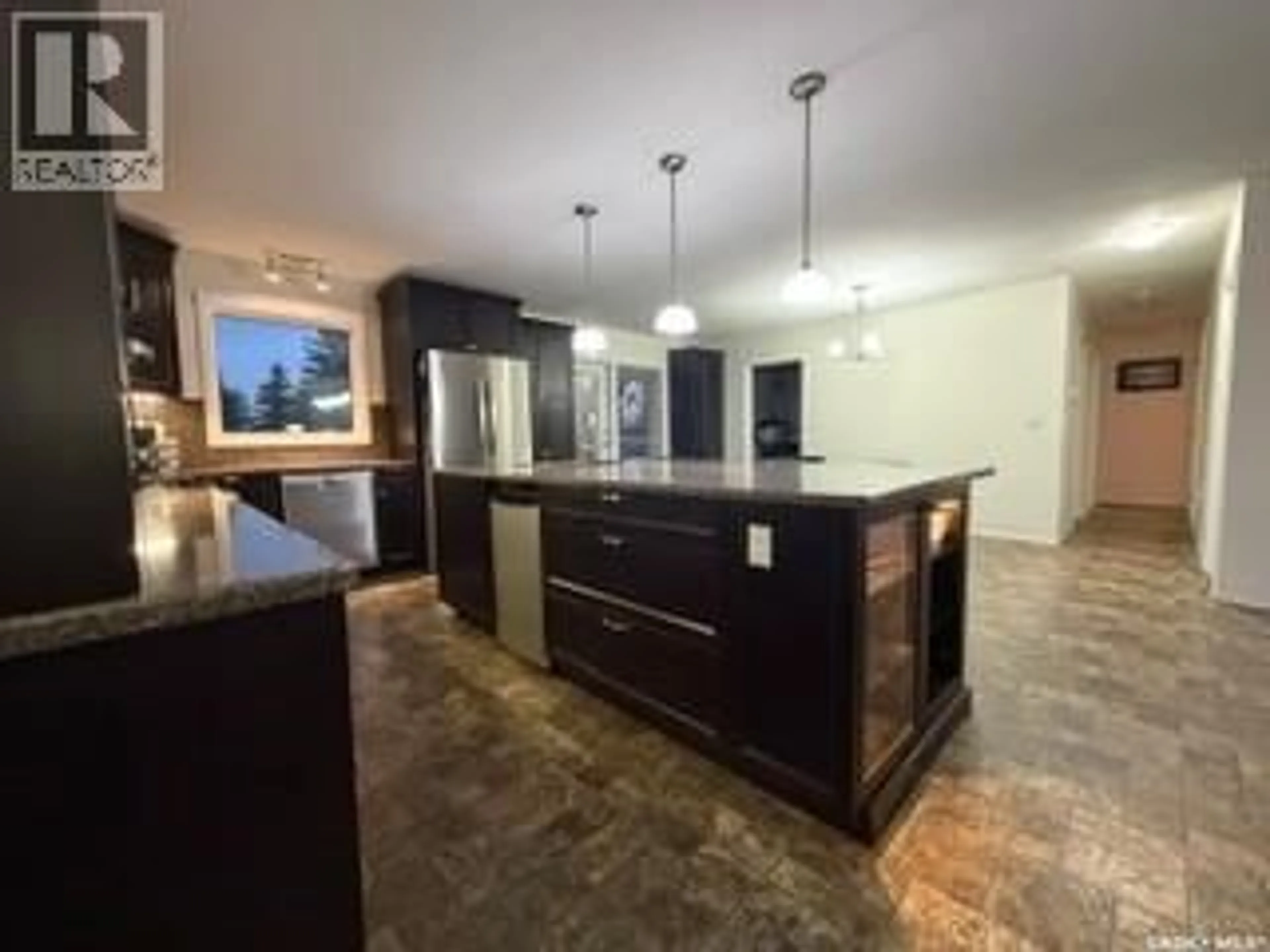 Open concept kitchen, ceramic/tile floor for 405 3RD AVENUE, Biggar Saskatchewan S0K0M0