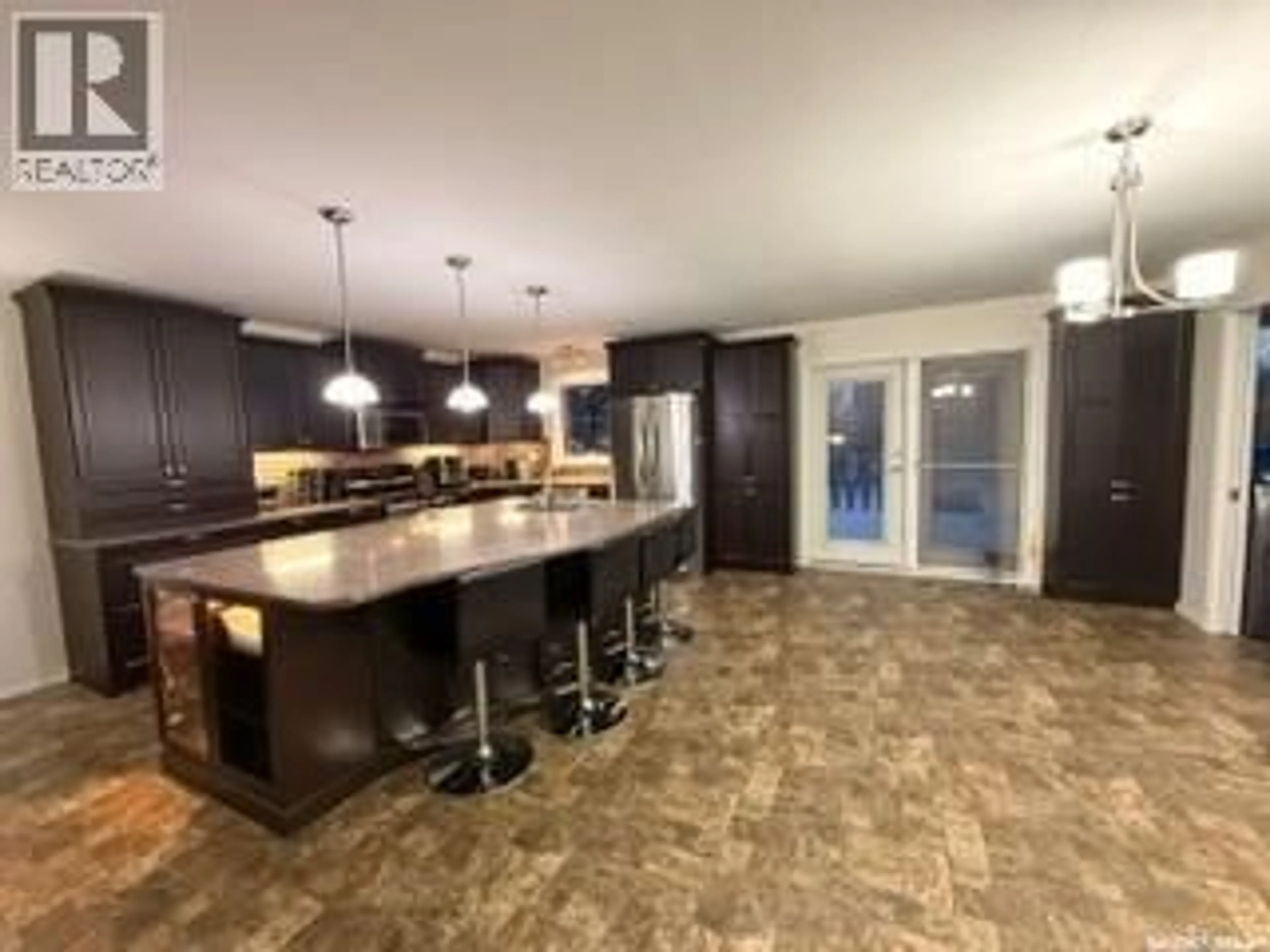 Open concept kitchen, ceramic/tile floor for 405 3RD AVENUE, Biggar Saskatchewan S0K0M0