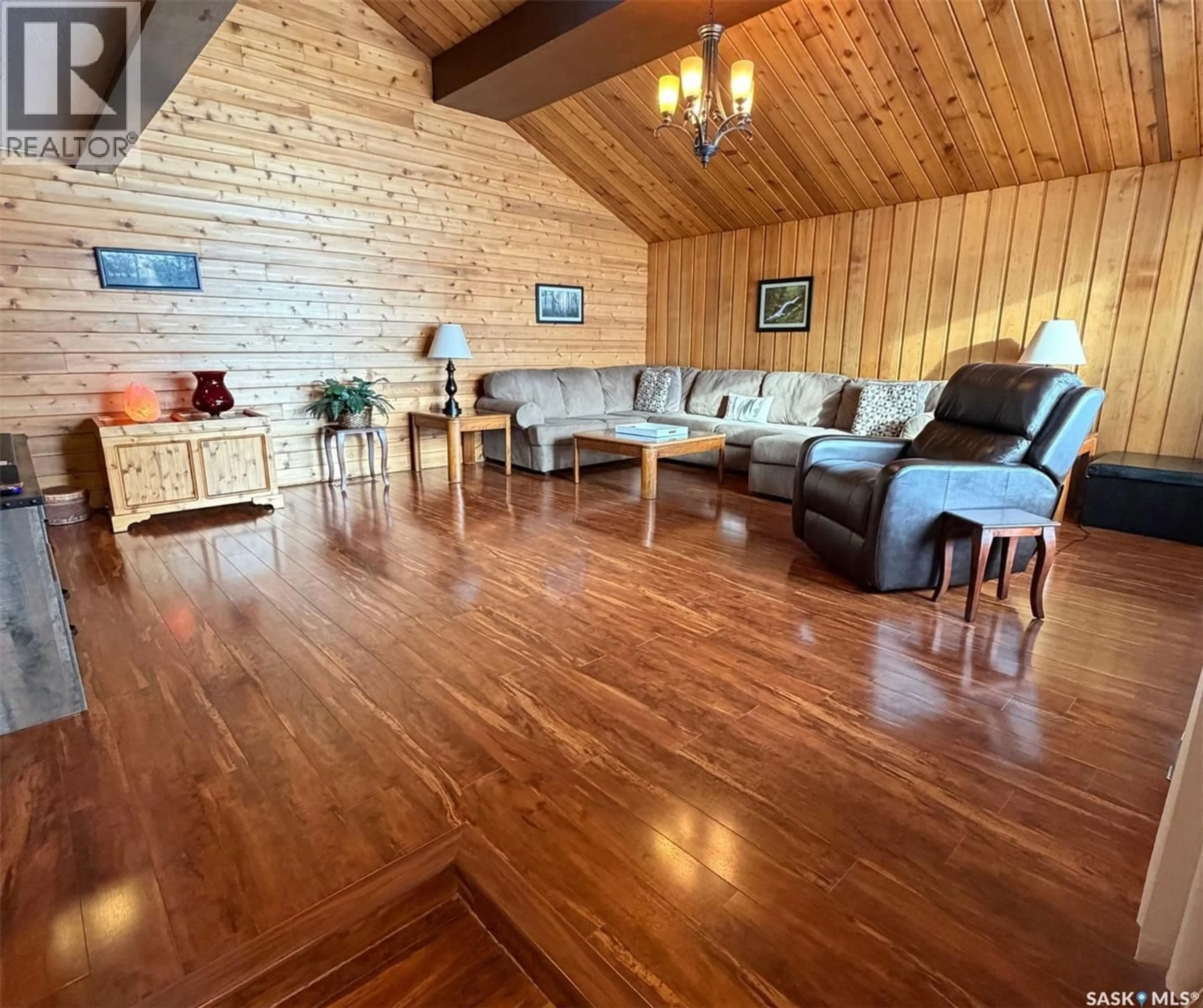 Living room with furniture, wood/laminate floor for 74 NUNN STREET, La Ronge Saskatchewan S0J1L0