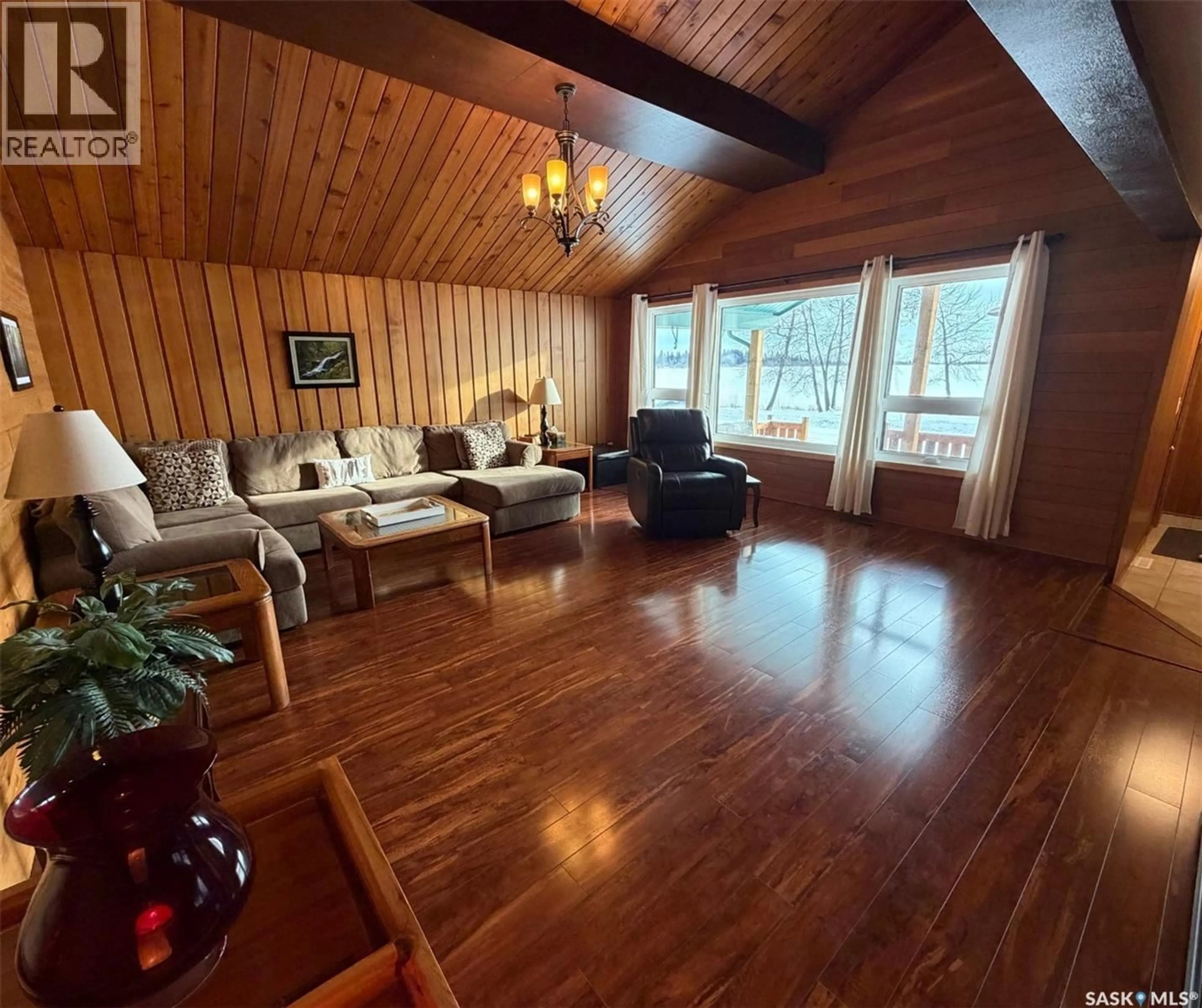 Living room with furniture, wood/laminate floor for 74 NUNN STREET, La Ronge Saskatchewan S0J1L0