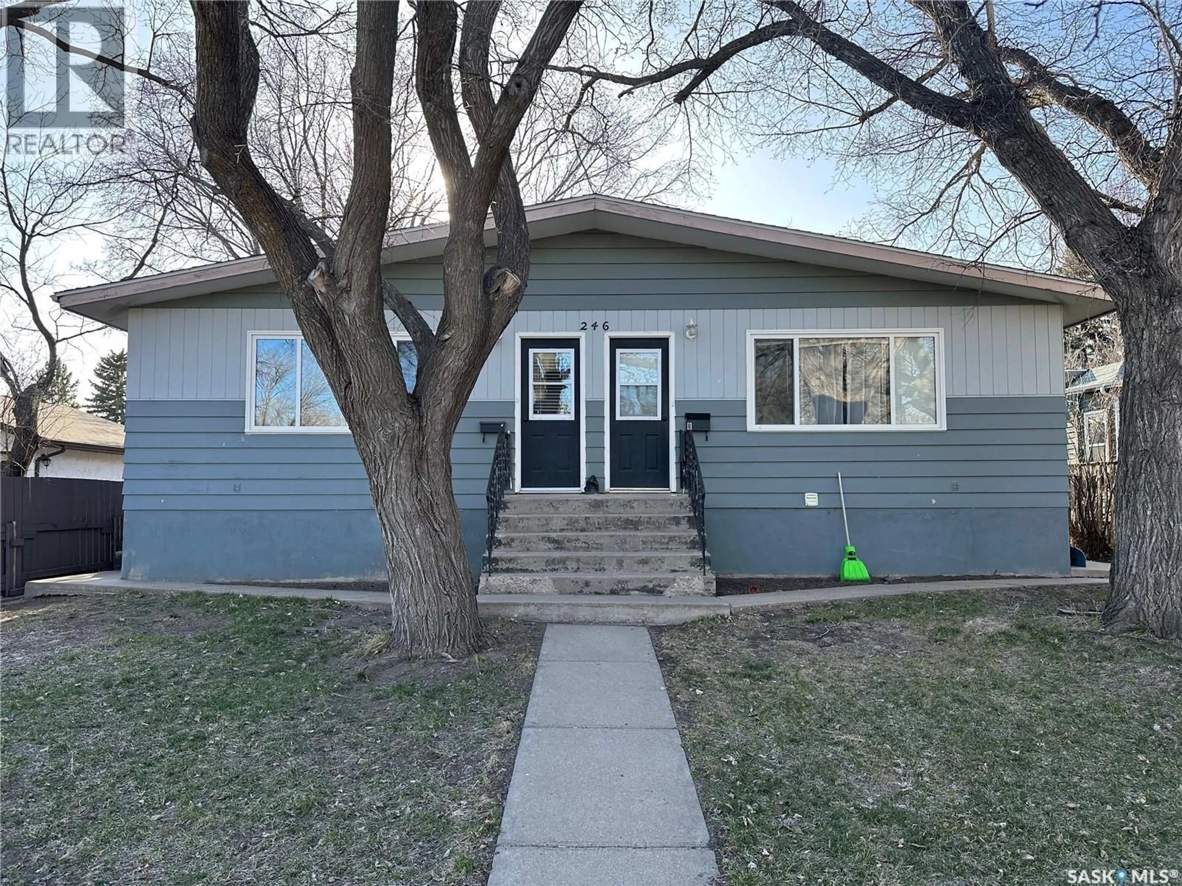 Home with vinyl exterior material, street for 246 5TH AVENUE, Swift Current Saskatchewan S9H0W3