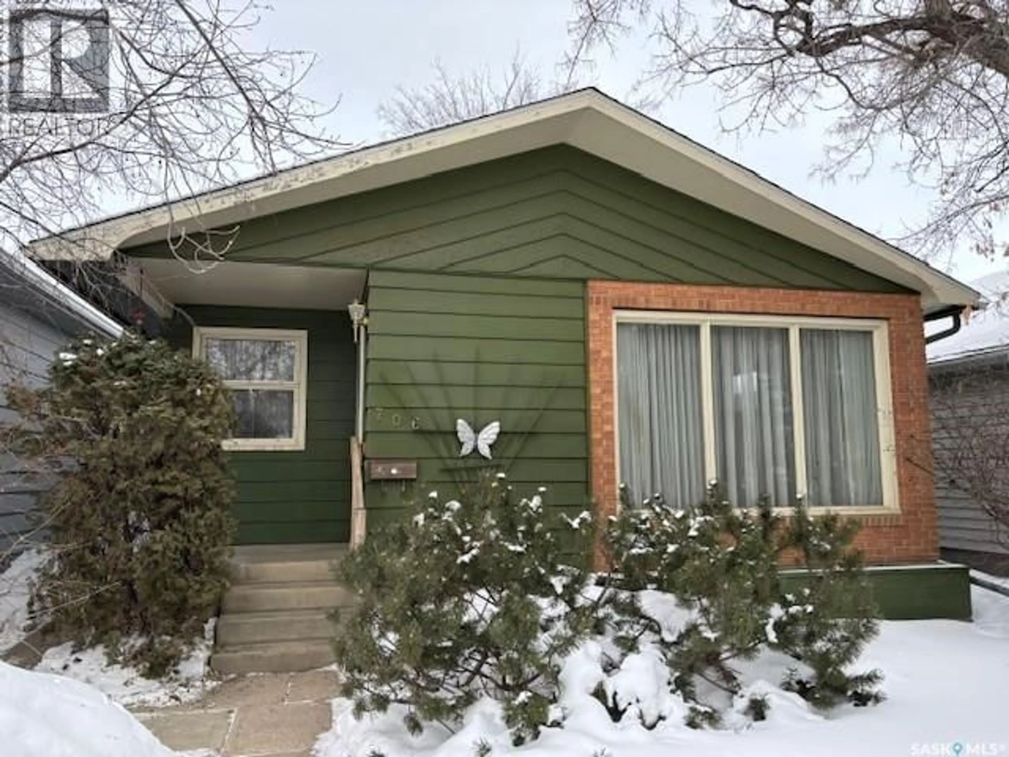 Home with vinyl exterior material, street for 706 BALMORAL STREET, Saskatoon Saskatchewan S7K0Y8