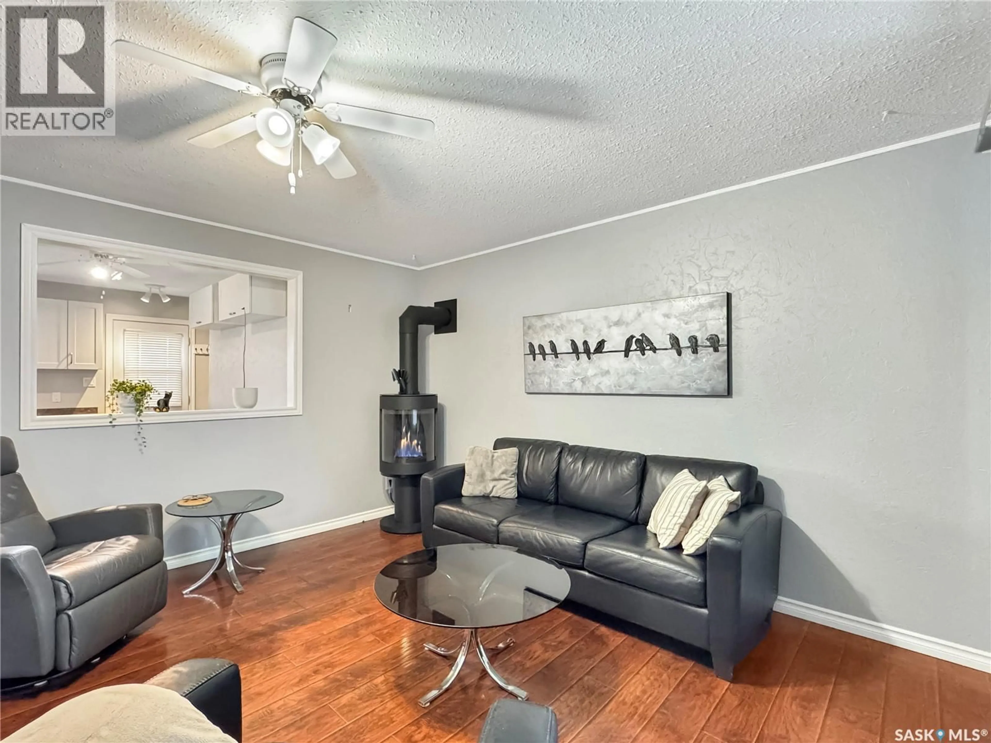 Living room with furniture, wood/laminate floor for 114 2ND AVENUE, Maymont Saskatchewan S0M1T0