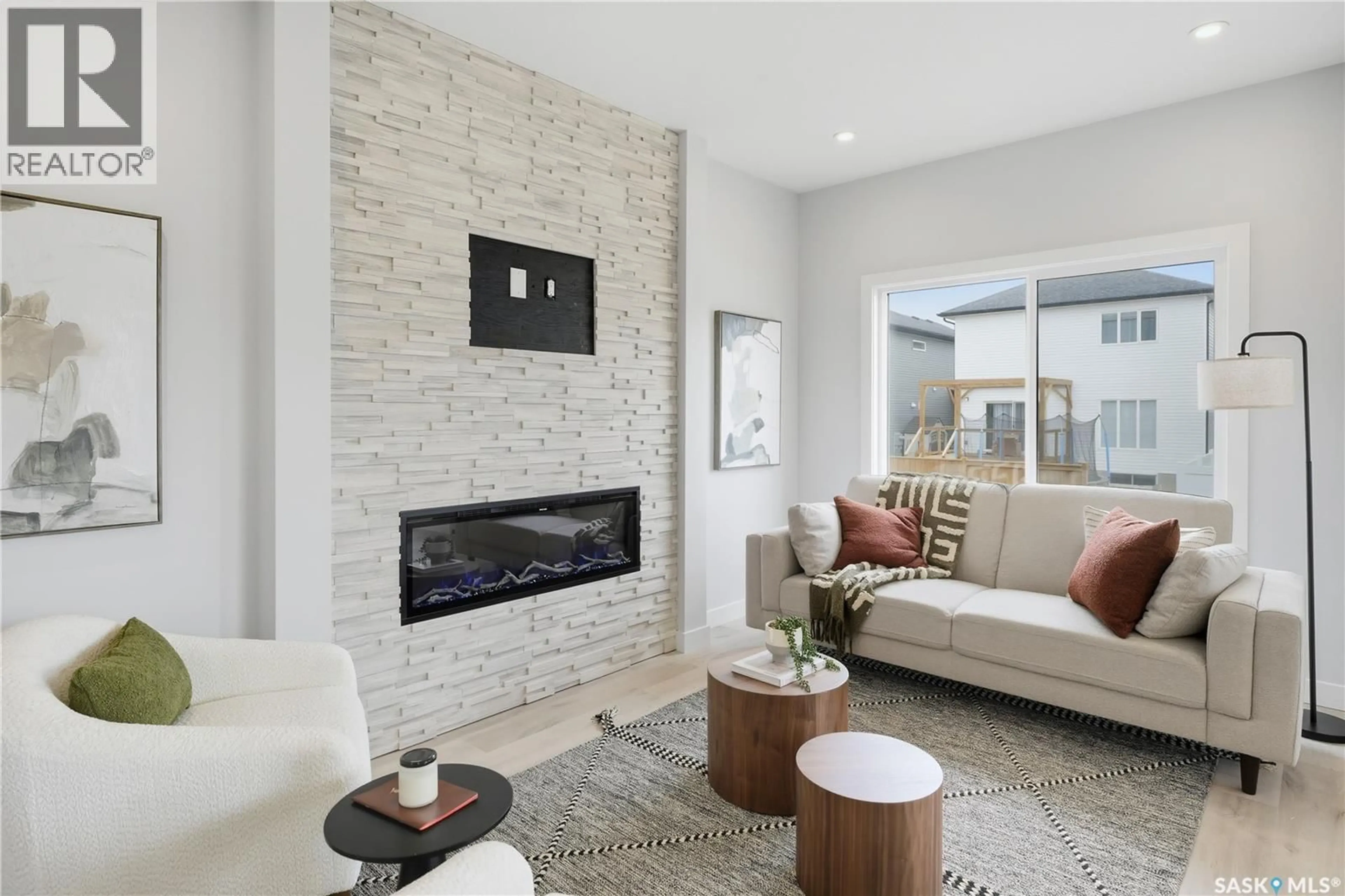 Living room with furniture, ceramic/tile floor for 1050 NIGHTINGALE TERRACE, Saskatoon Saskatchewan S7W0N8