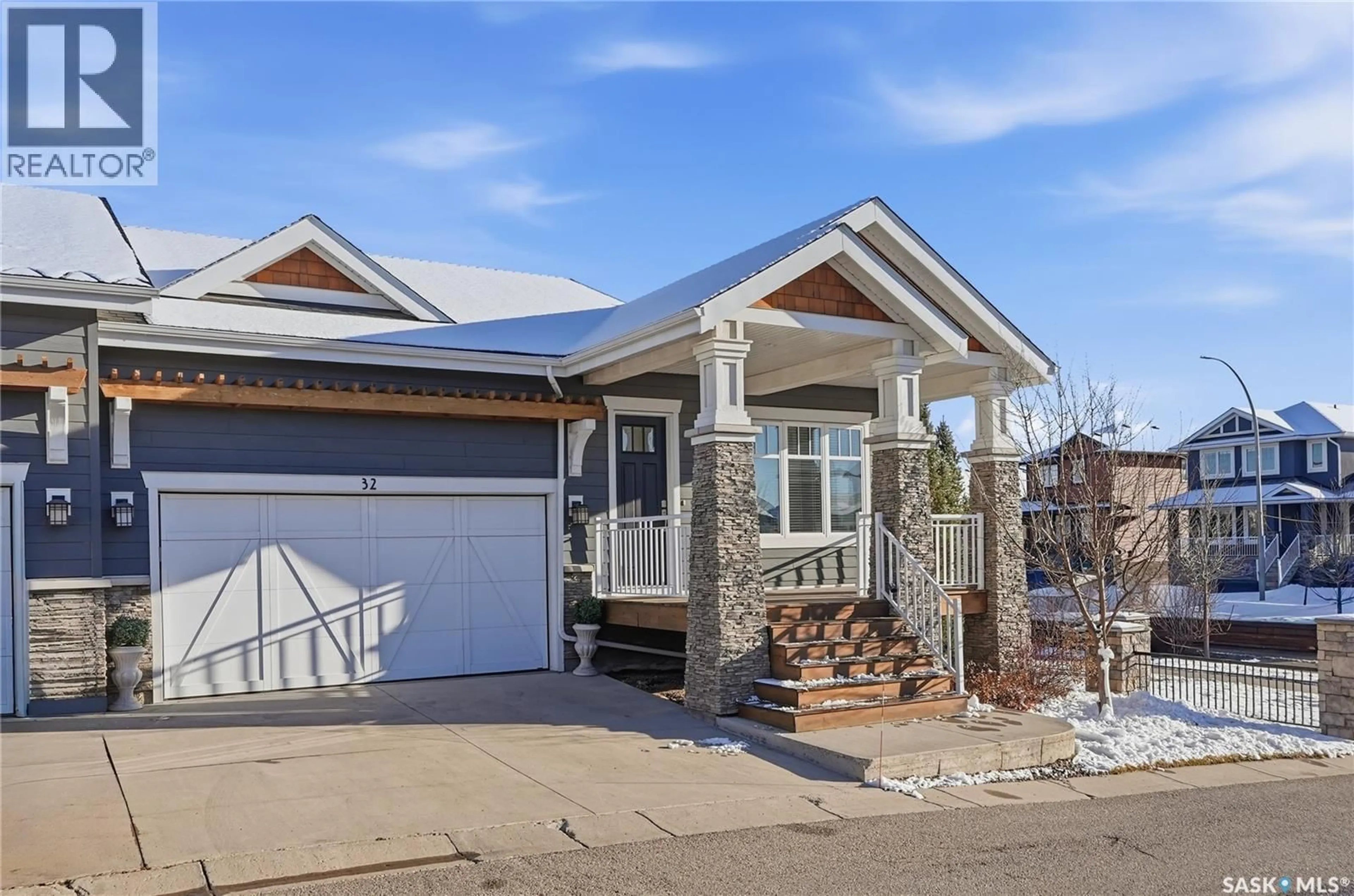 Home with vinyl exterior material, street for 32 115 MEADOWS BOULEVARD, Saskatoon Saskatchewan S7V0E6