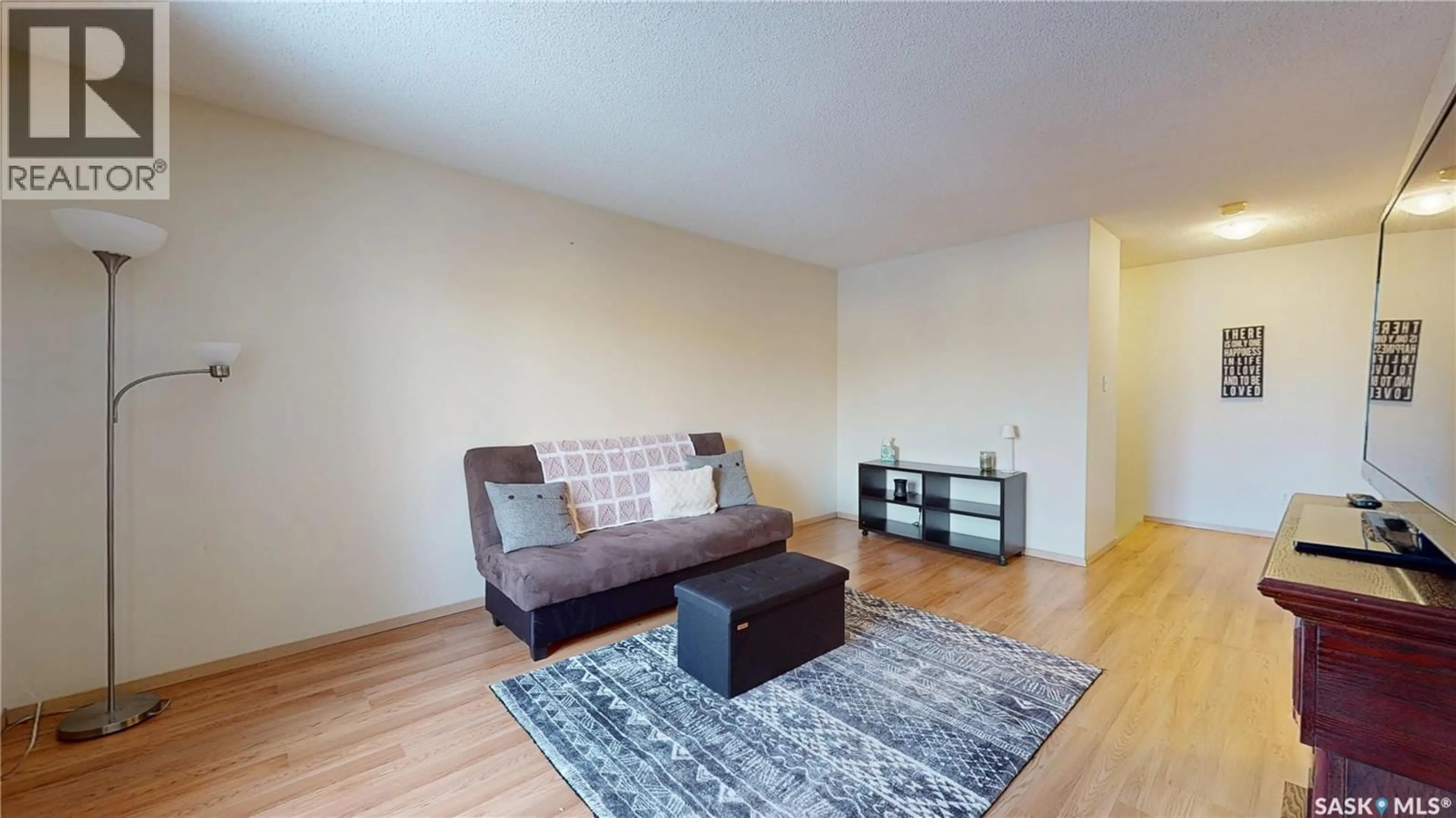 Living room with furniture, wood/laminate floor for 3876 7TH AVENUE, Regina Saskatchewan S4N7K8
