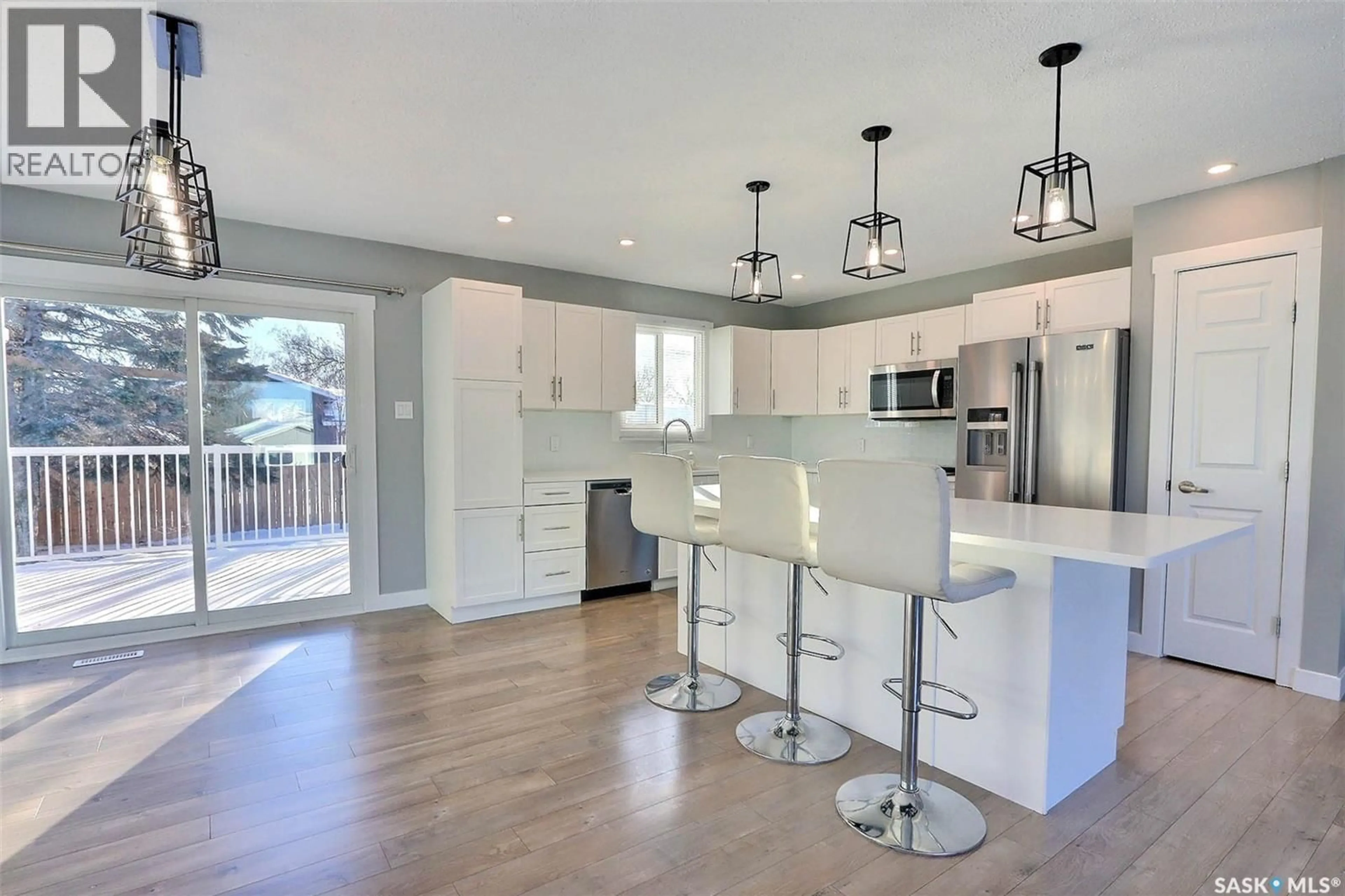 Open concept kitchen, wood/laminate floor for 1355 LACROIX CRESCENT, Prince Albert Saskatchewan S6V6R2