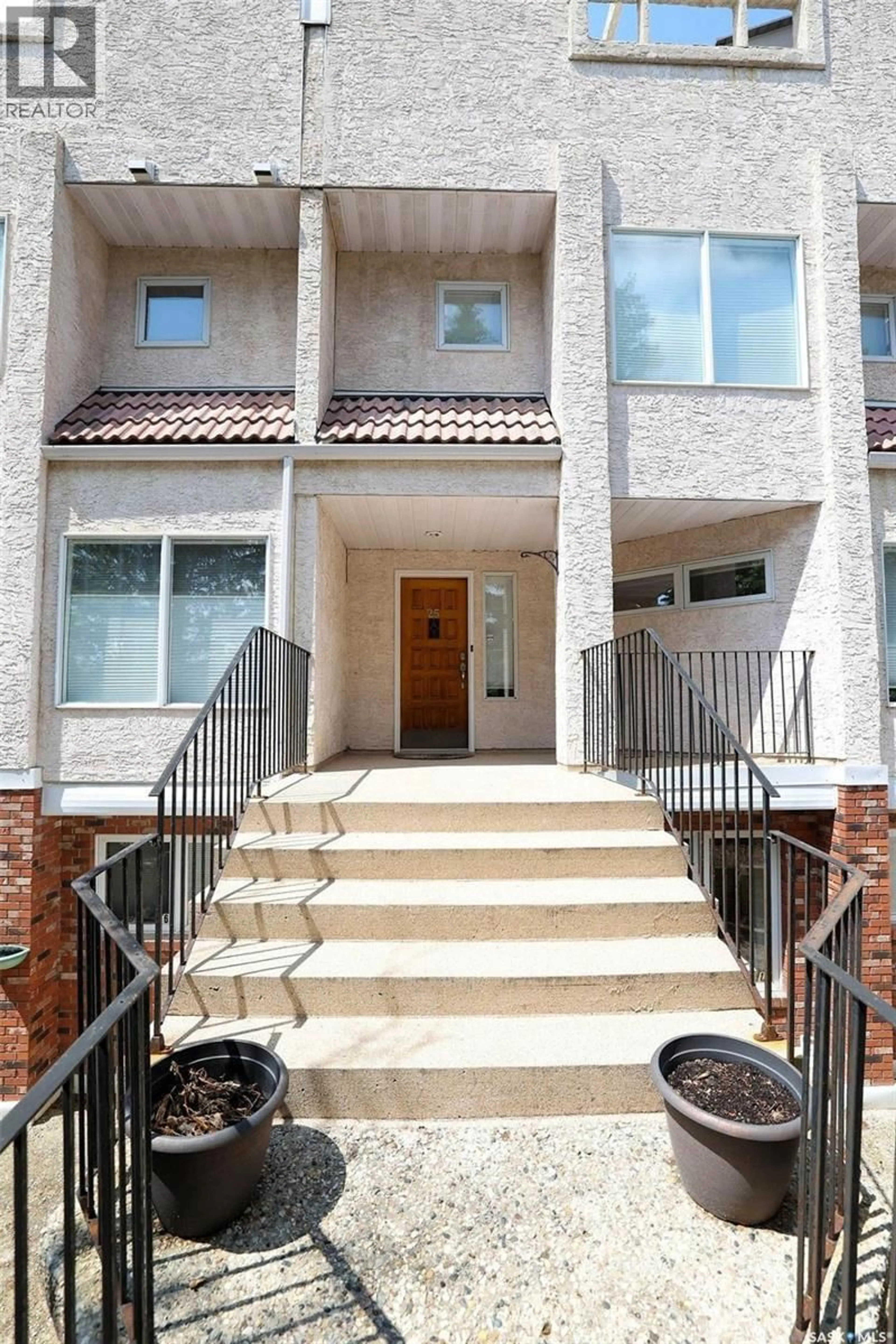 Home with brick exterior material, street for 25 2338 ASSINIBOINE AVENUE E, Regina Saskatchewan S4V2G2