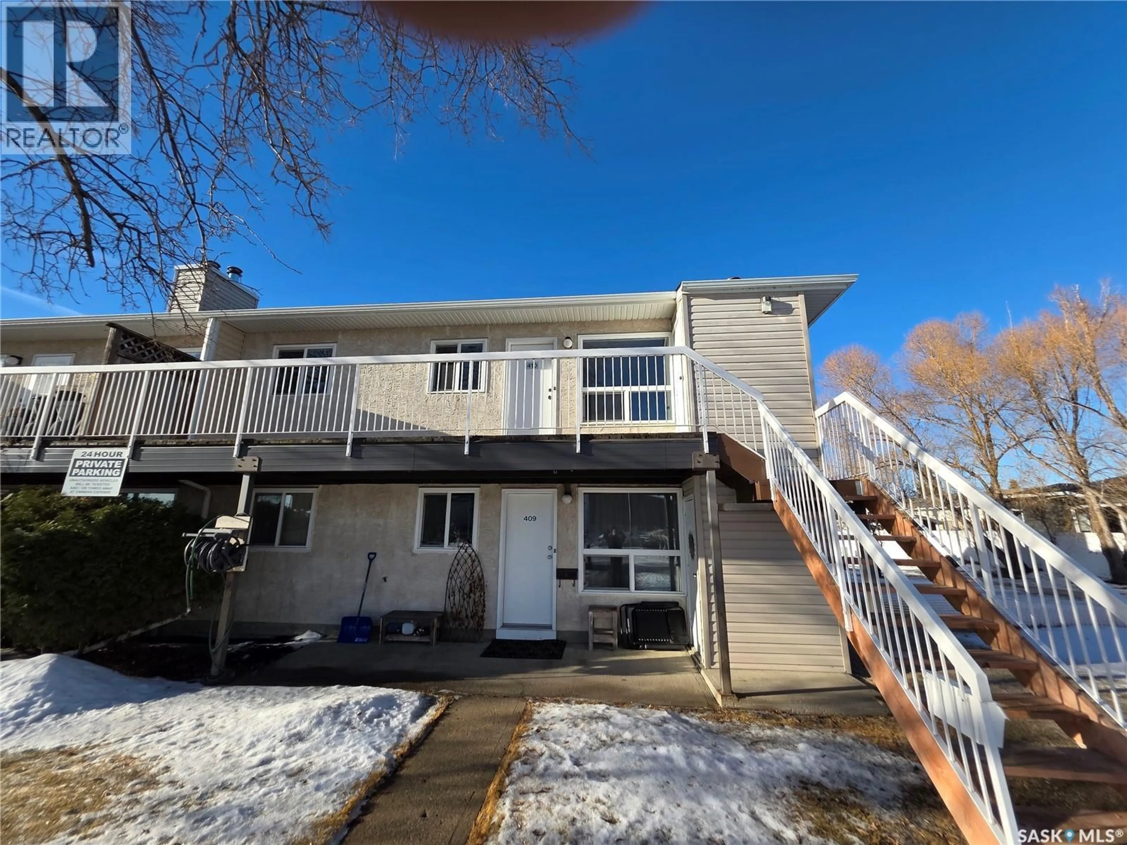 A pic from outside/outdoor area/front of a property/back of a property/a pic from drone, street for 410 67 WOOD LILY DRIVE, Moose Jaw Saskatchewan S6J1G6