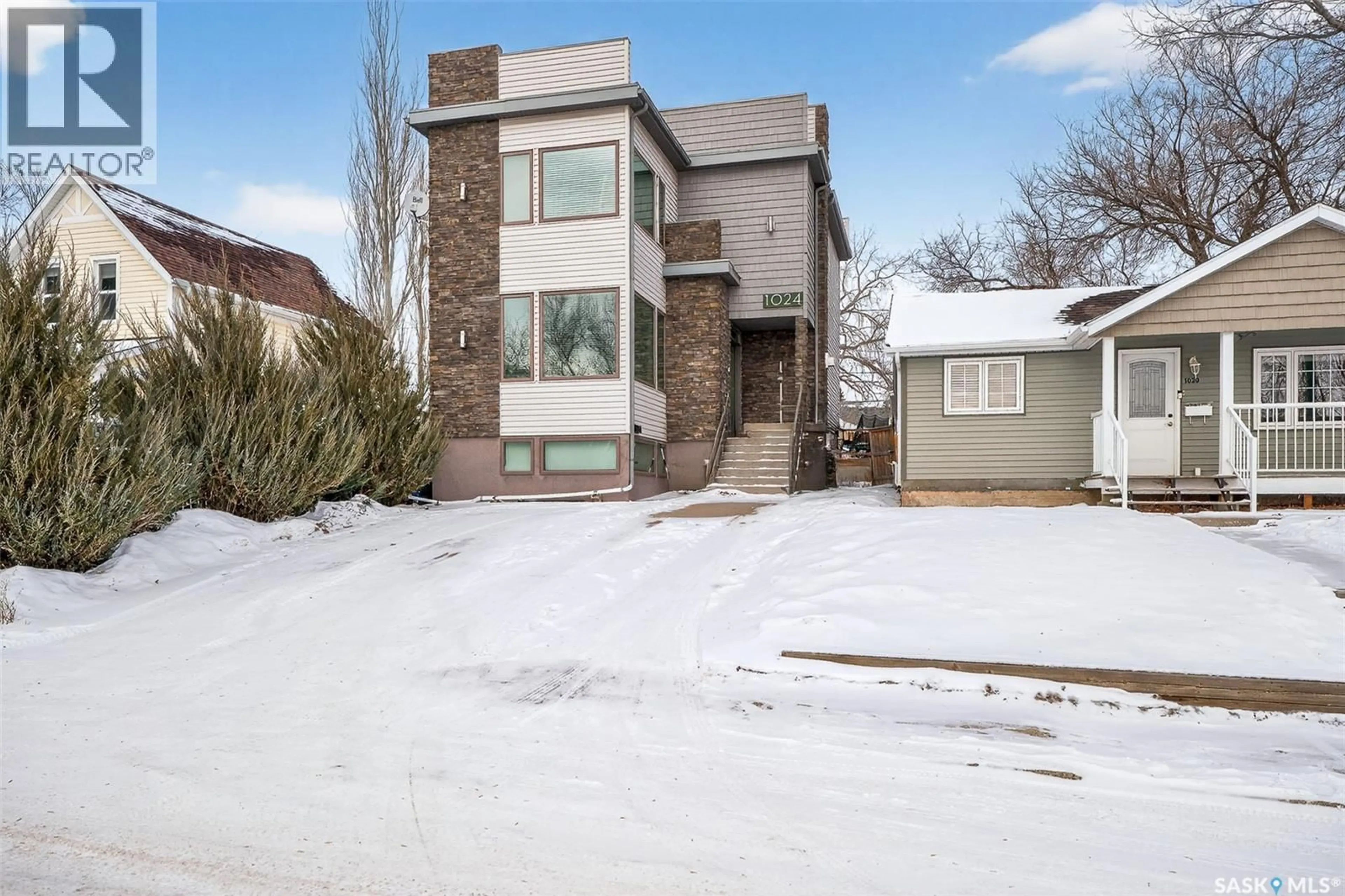 Home with brick exterior material, street for 1024 HOCHELAGA STREET, Moose Jaw Saskatchewan S6H2H9