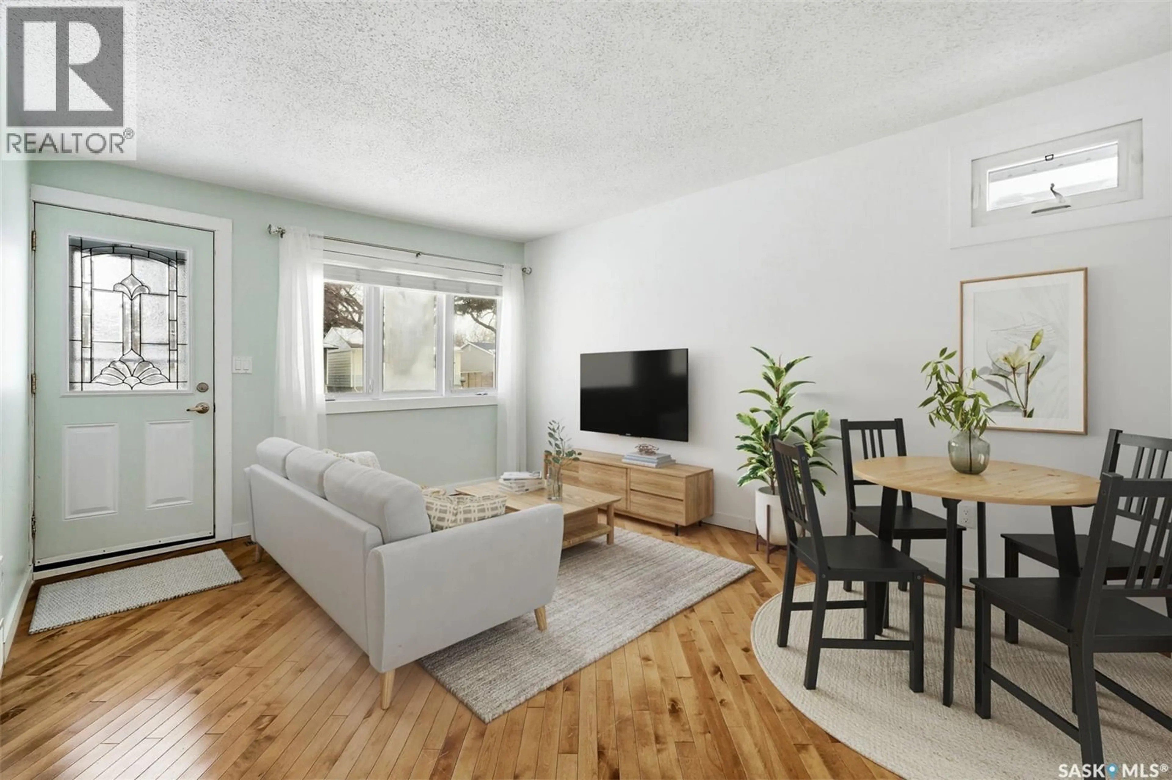 Living room with furniture, wood/laminate floor for 336 SMITH STREET, Regina Saskatchewan S4R2K9