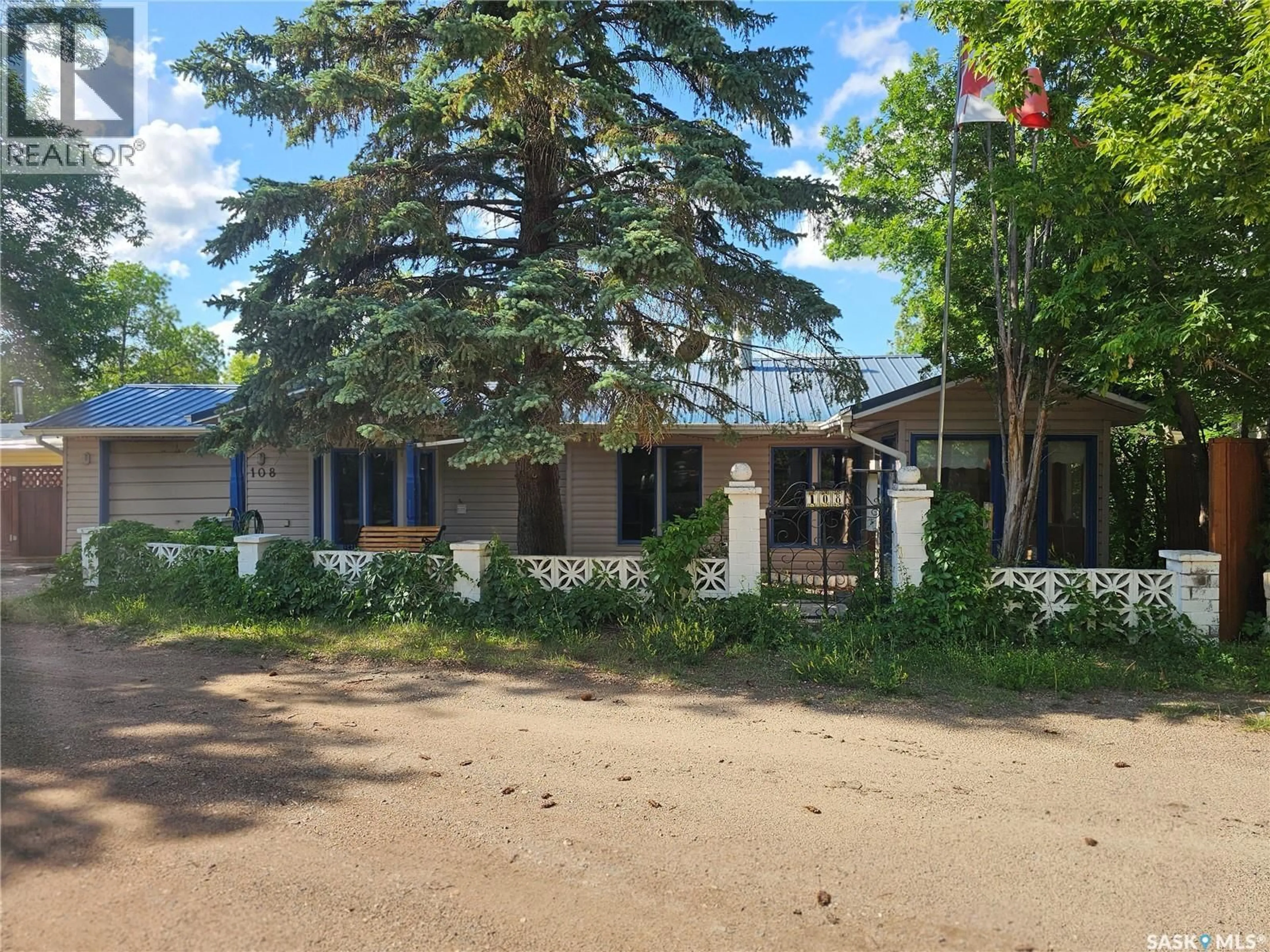 A pic from outside/outdoor area/front of a property/back of a property/a pic from drone, street for 108 BRIERE DRIVE, Regina Beach Saskatchewan S0G4C0