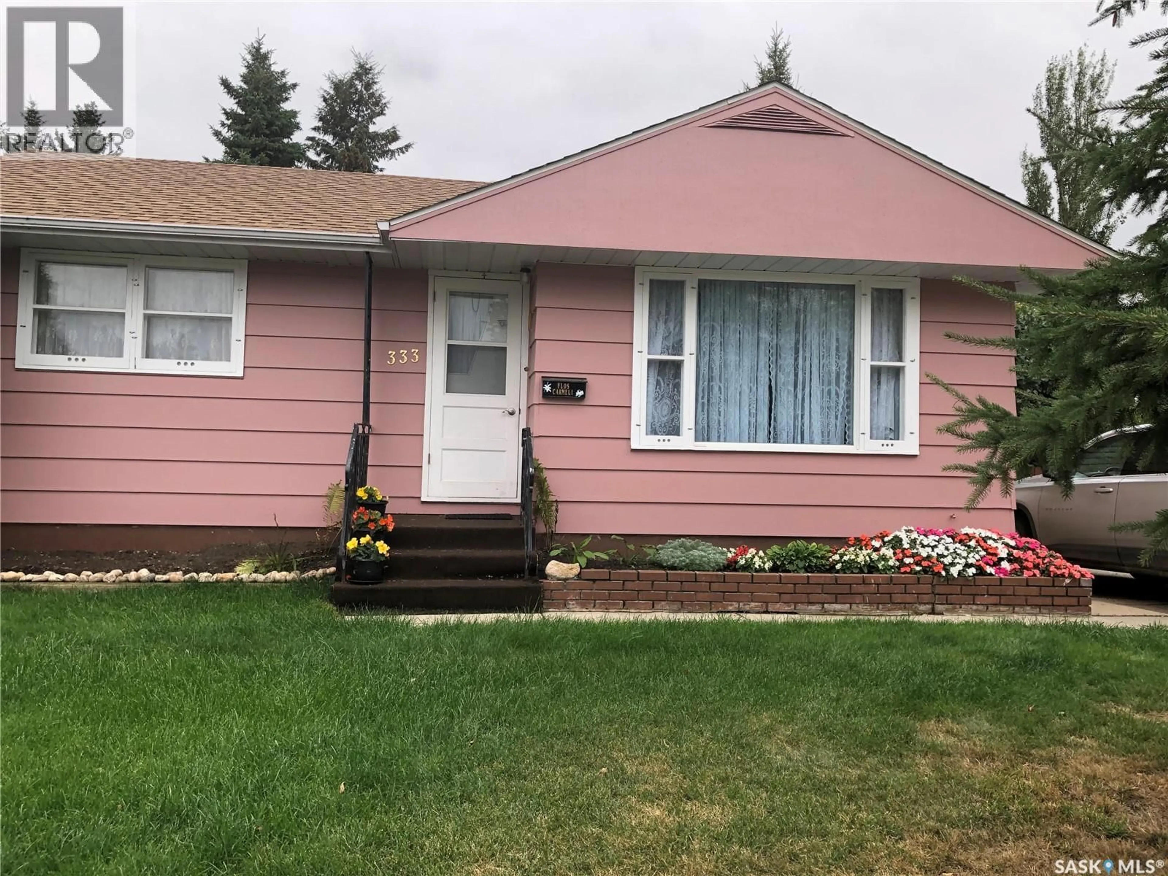 Home with vinyl exterior material, street for 333 25TH STREET, Prince Albert Saskatchewan S6V4P5