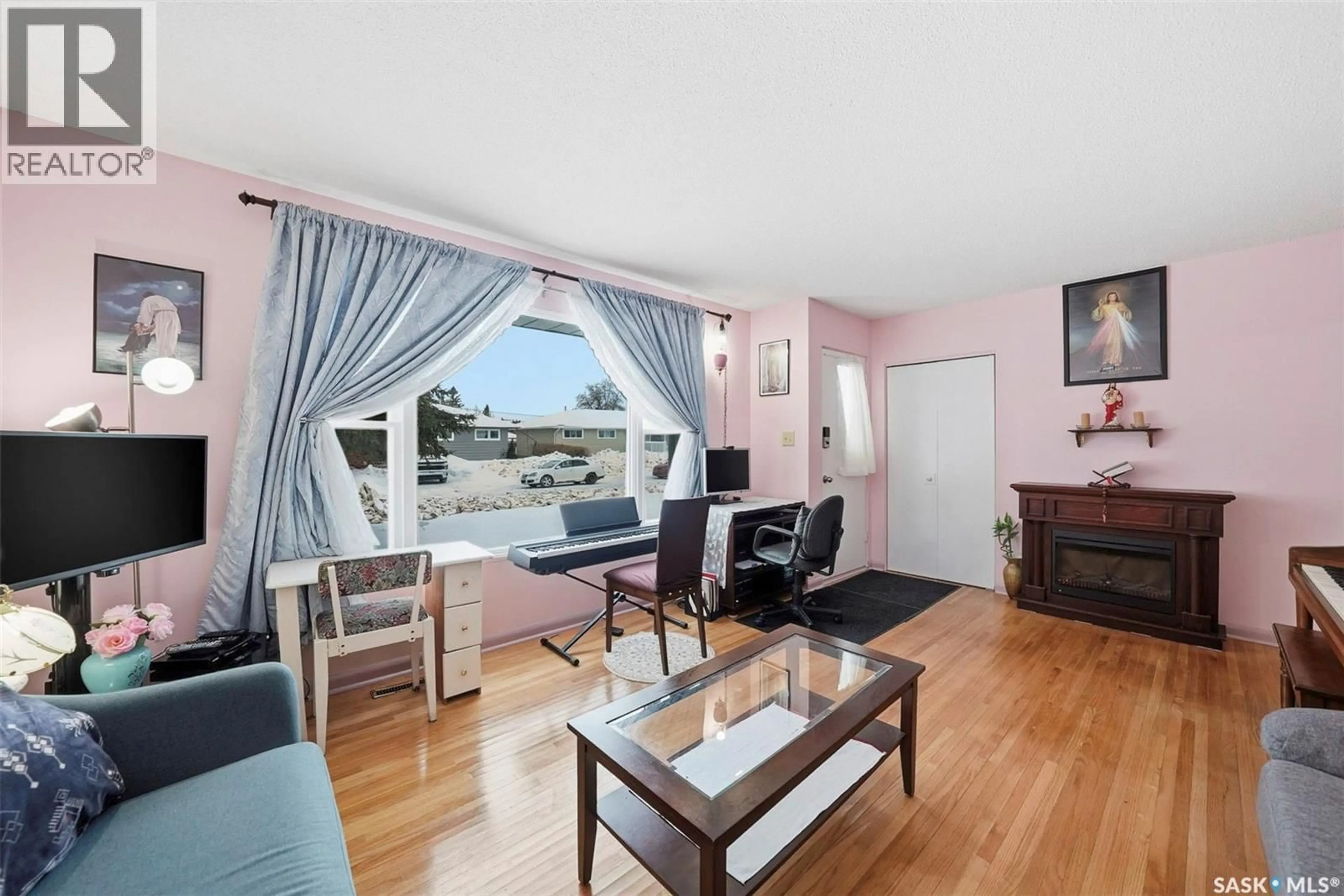 Living room with furniture, wood/laminate floor for 333 25TH STREET, Prince Albert Saskatchewan S6V4P5