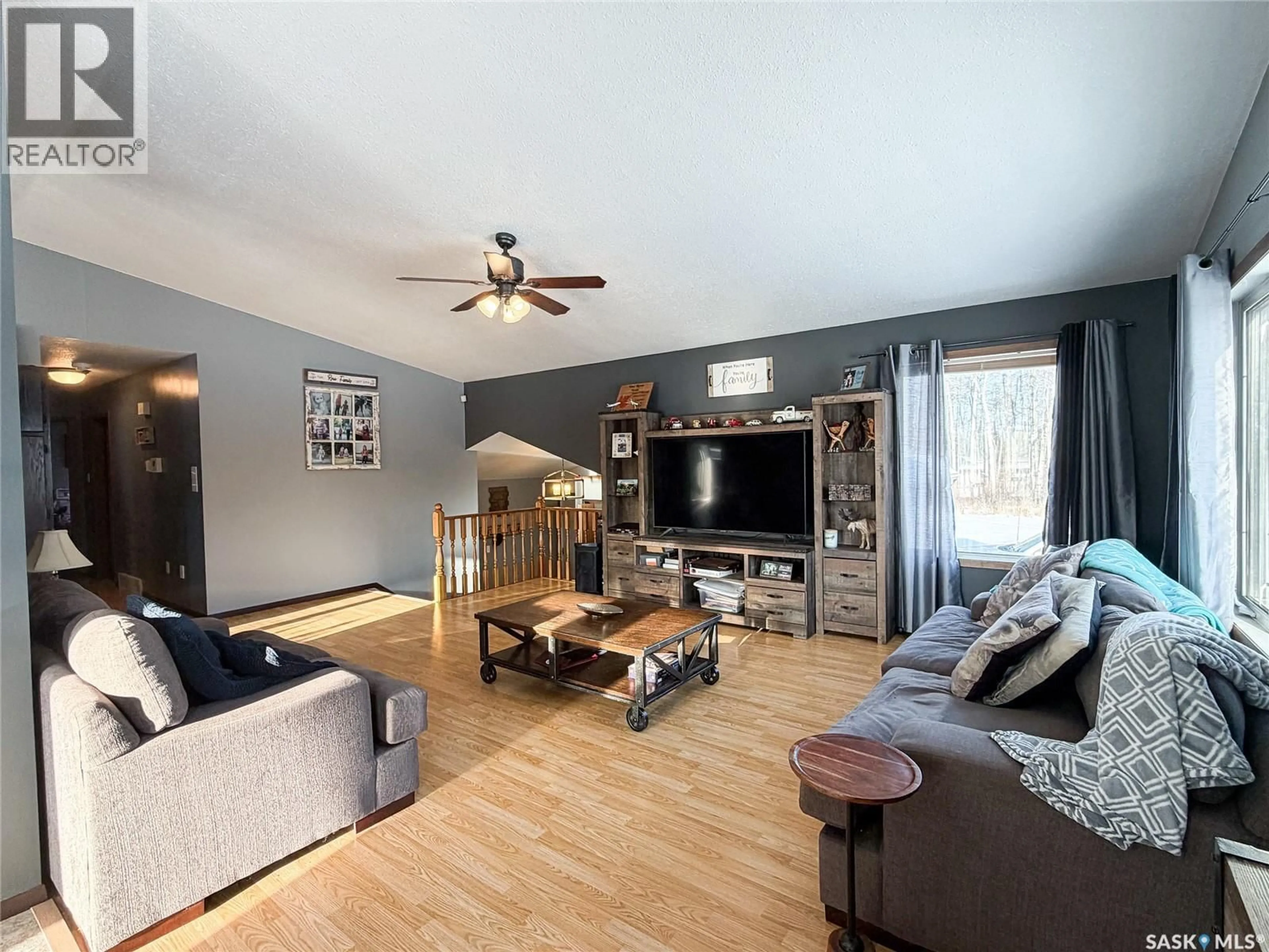 Living room with furniture, wood/laminate floor for RAILTO ACREAGE, Meadow Lake Rm No.588 Saskatchewan S9X1Z4