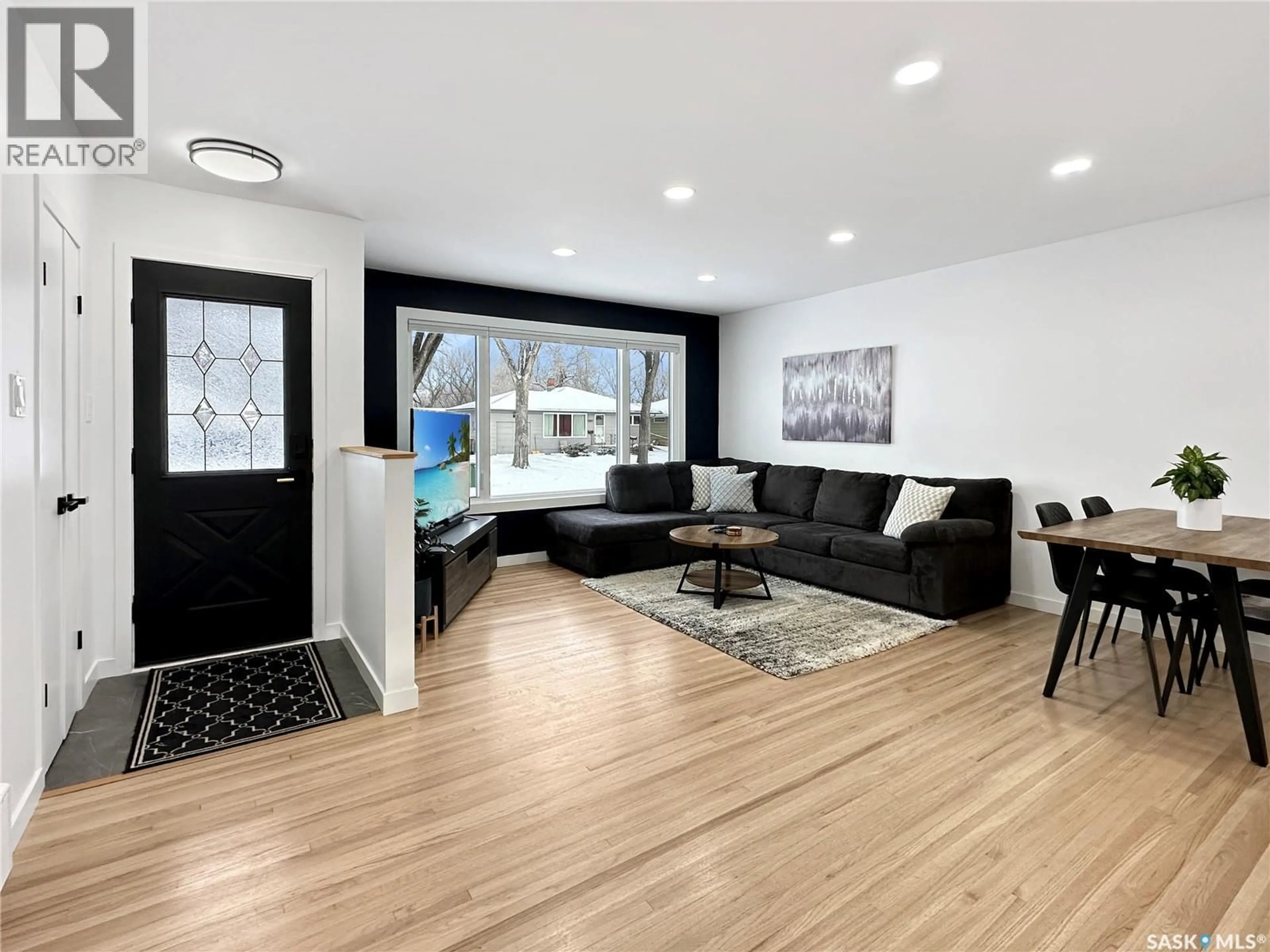 Living room with furniture, wood/laminate floor for 31 DAFFODIL CRESCENT, Regina Saskatchewan S4S5A2