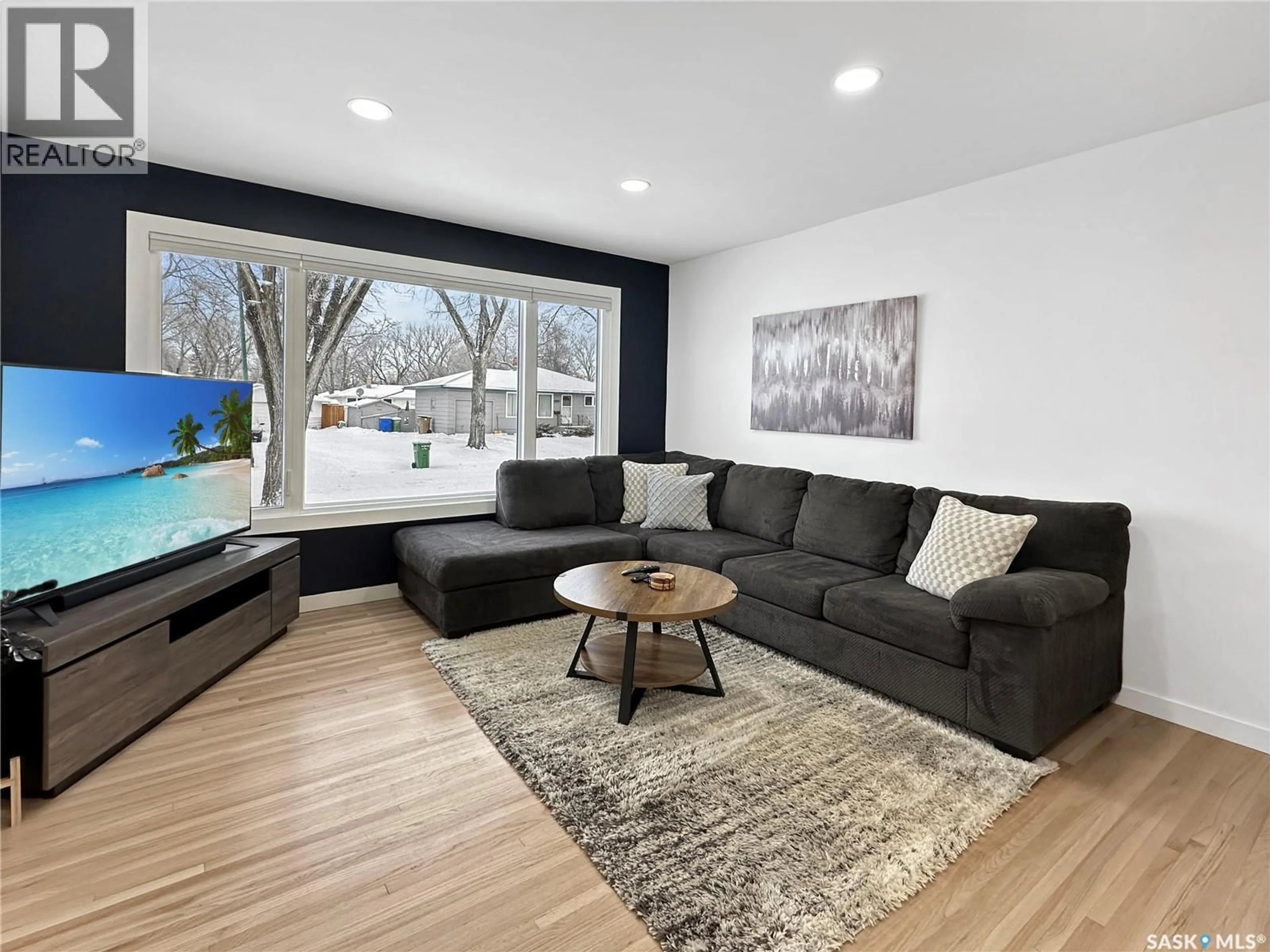 Living room with furniture, wood/laminate floor for 31 DAFFODIL CRESCENT, Regina Saskatchewan S4S5A2