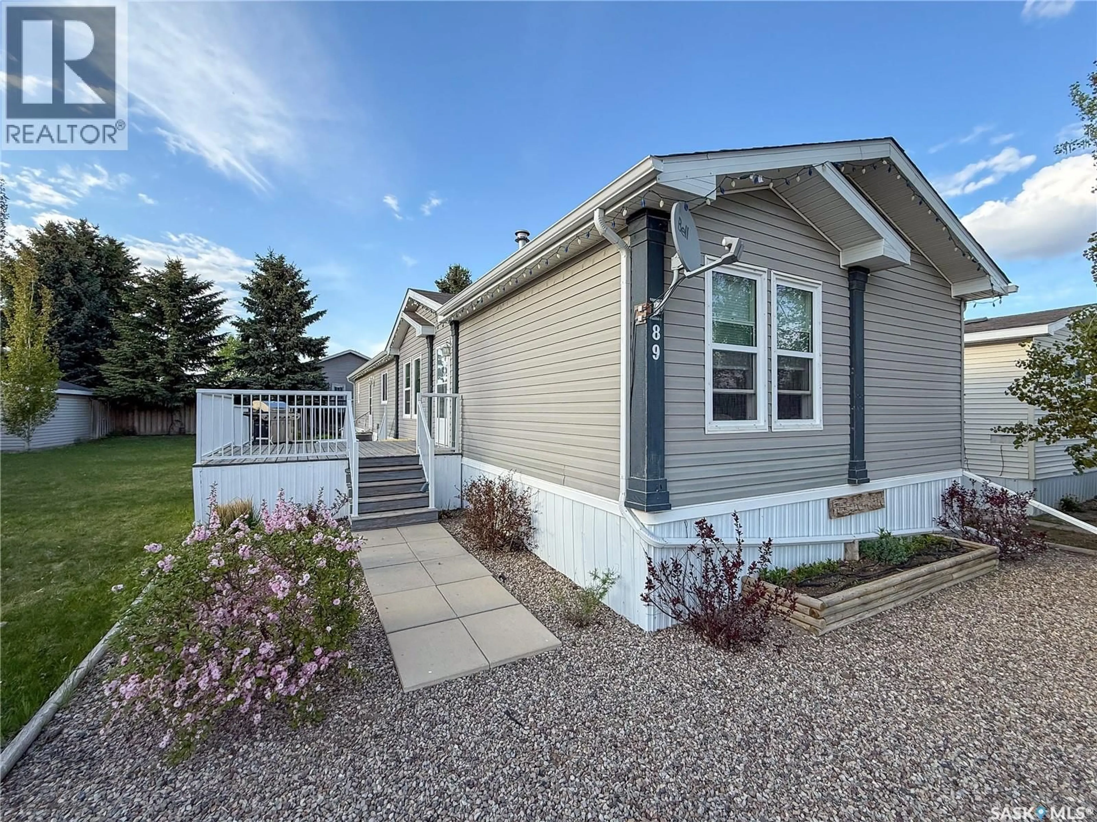 Home with vinyl exterior material, street for 89 PRAIRIE SUN COURT, Swift Current Saskatchewan S9H3X6