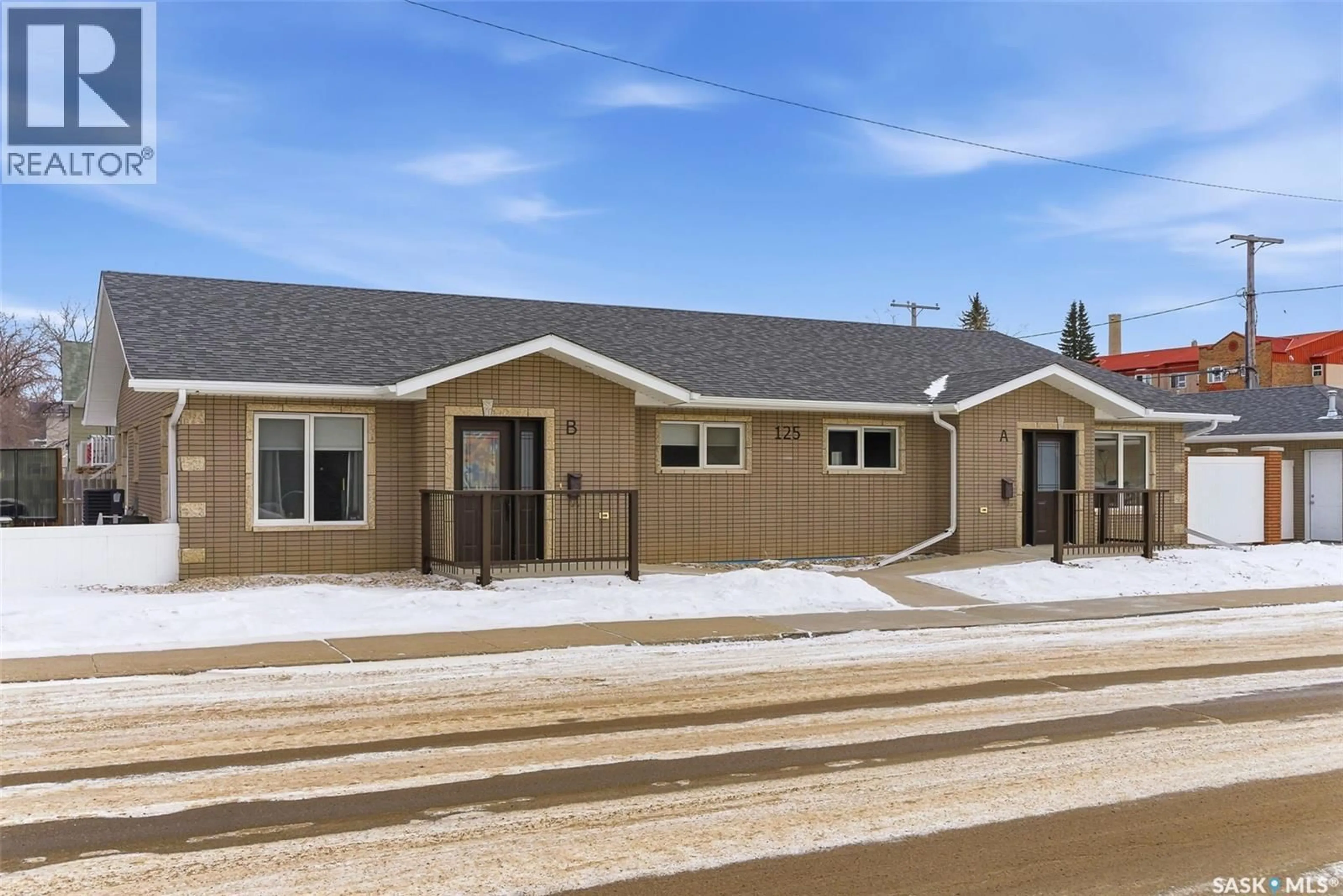 Home with vinyl exterior material, street for A&B - 125 2ND AVENUE, Moose Jaw Saskatchewan S6H2A2