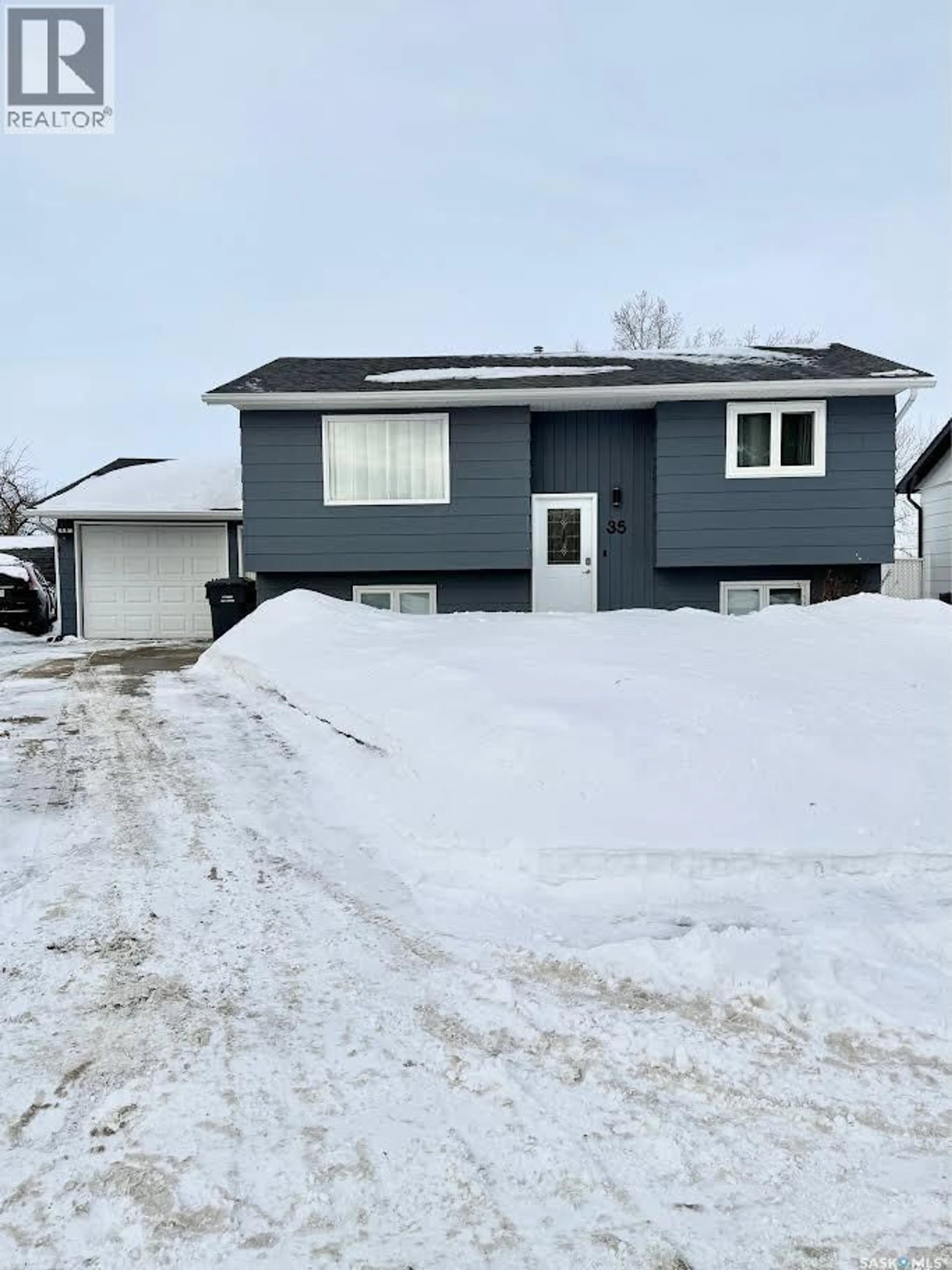 Home with vinyl exterior material, street for 35 COLLACOTT DRIVE, Yorkton Saskatchewan S3N3E5