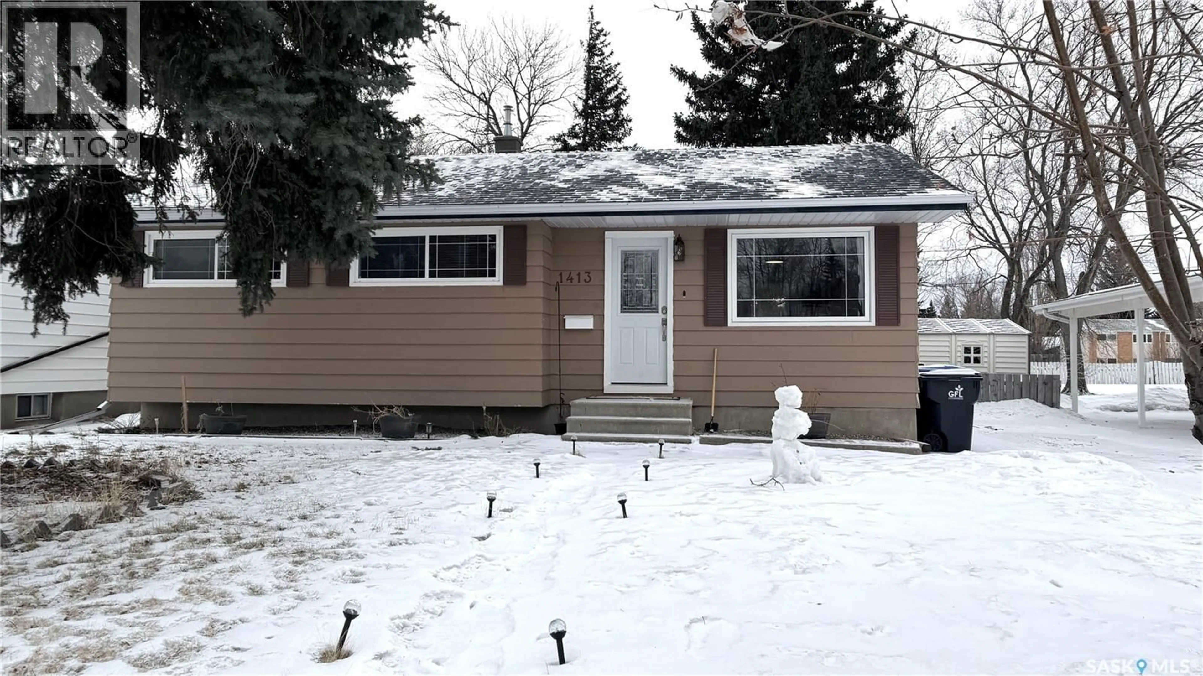 Home with vinyl exterior material, street for 1413 NICHOLSON ROAD, Estevan Saskatchewan S4A1T6