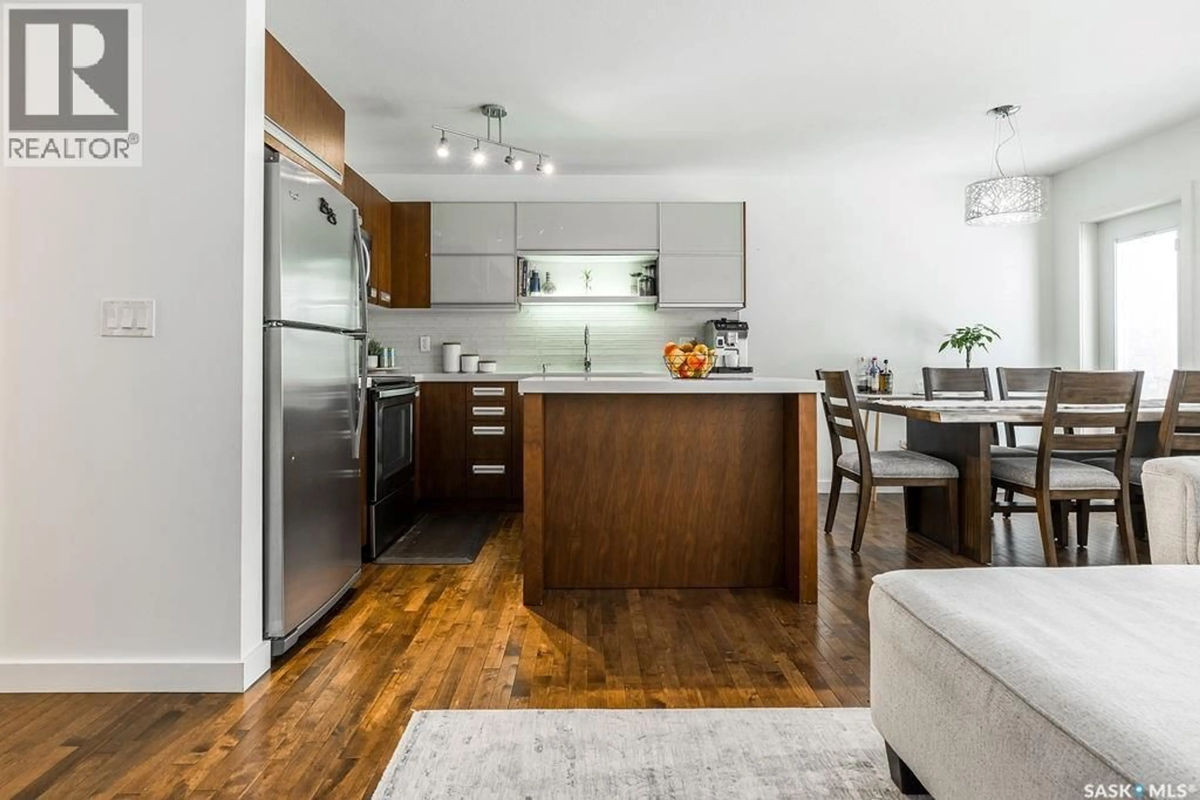 Open concept kitchen, wood/laminate floor for 422 1303 PATON CRESCENT, Saskatoon Saskatchewan S7W0P7