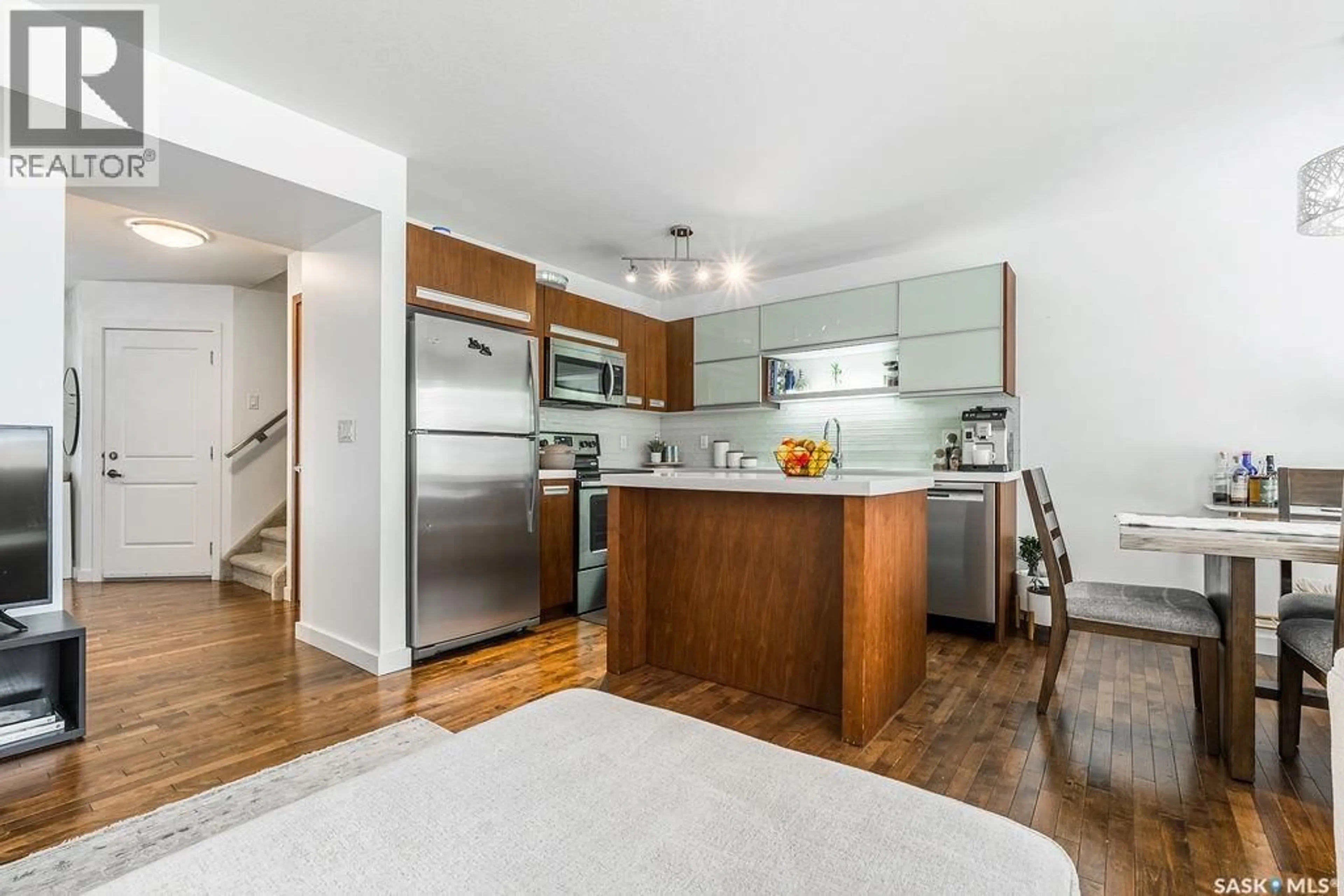 Open concept kitchen, wood/laminate floor for 422 1303 PATON CRESCENT, Saskatoon Saskatchewan S7W0P7