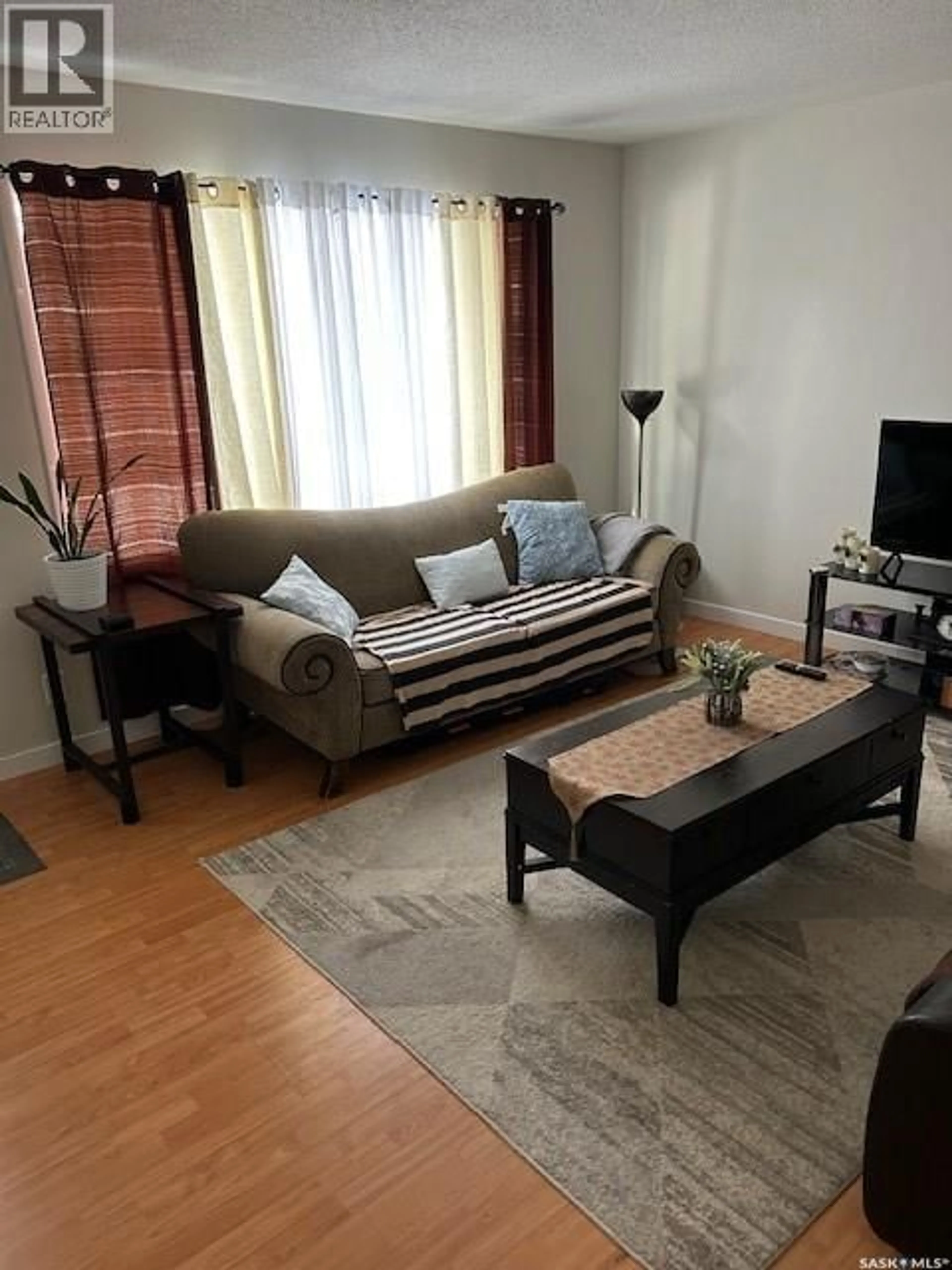 Living room with furniture, unknown for A and B - 402 ASH STREET, Saskatoon Saskatchewan S7J0K5