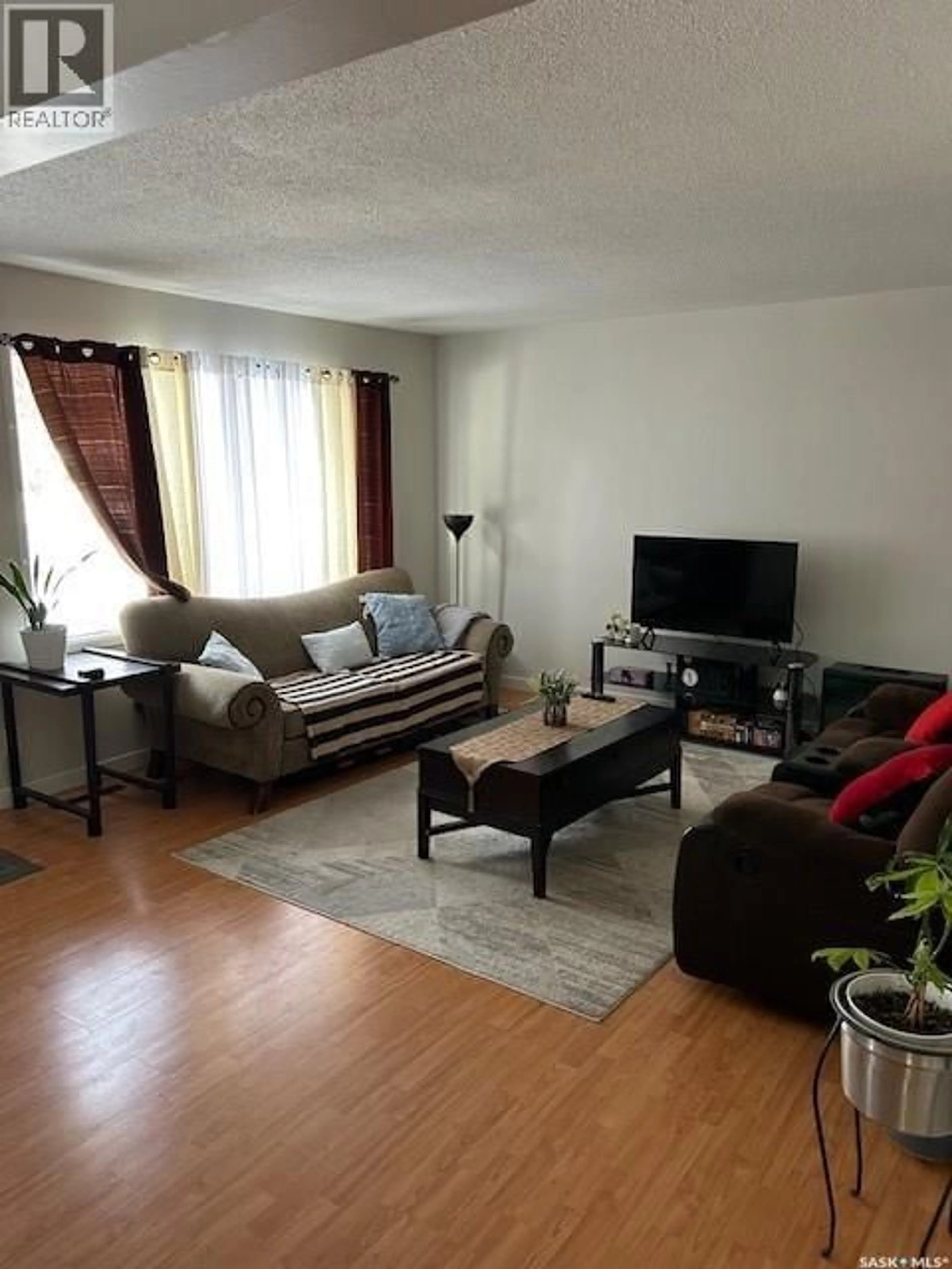 Living room with furniture, unknown for A and B - 402 ASH STREET, Saskatoon Saskatchewan S7J0K5