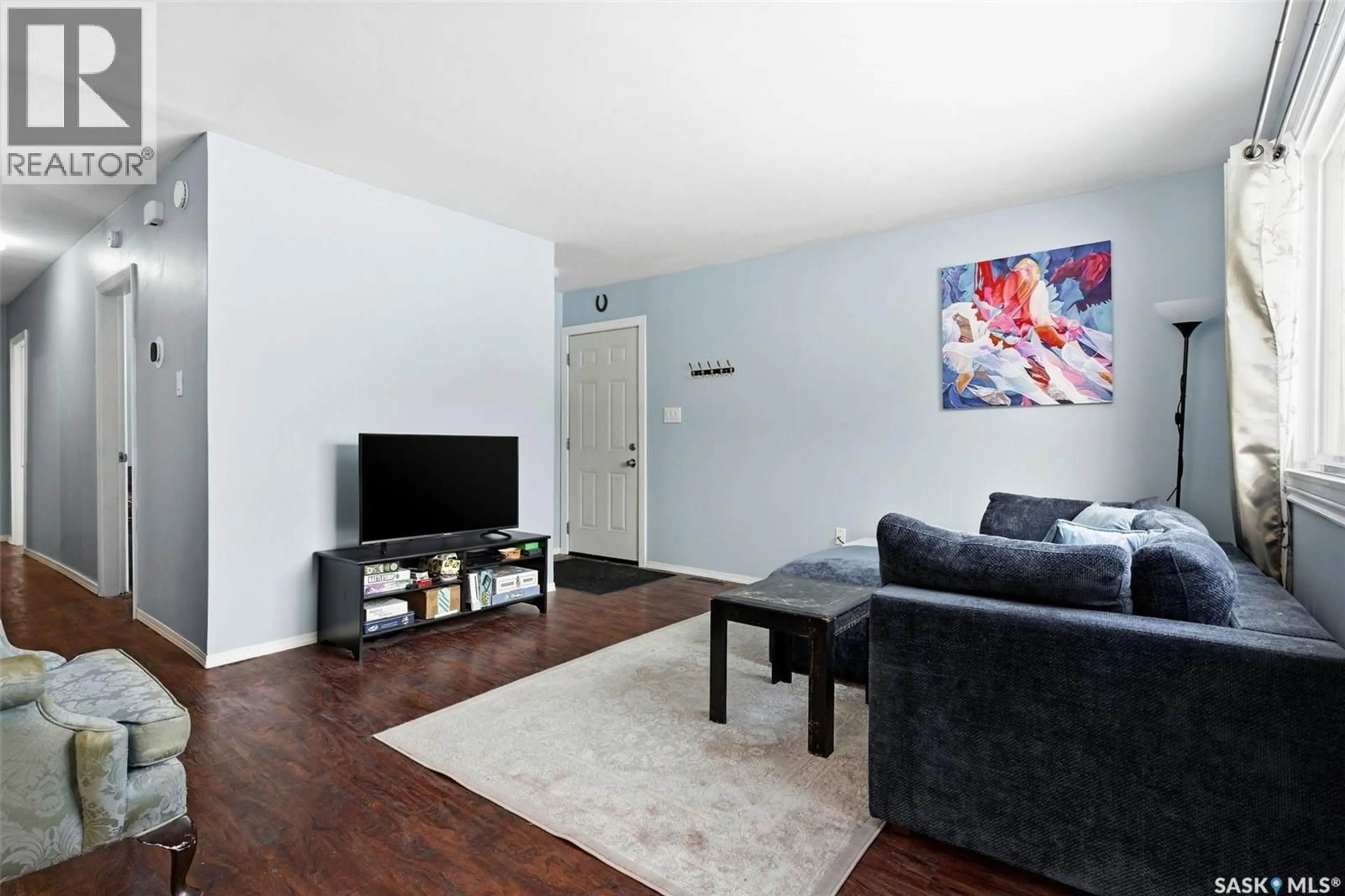 Living room with furniture, wood/laminate floor for 640 ARTHUR STREET, Regina Saskatchewan S4T4V2