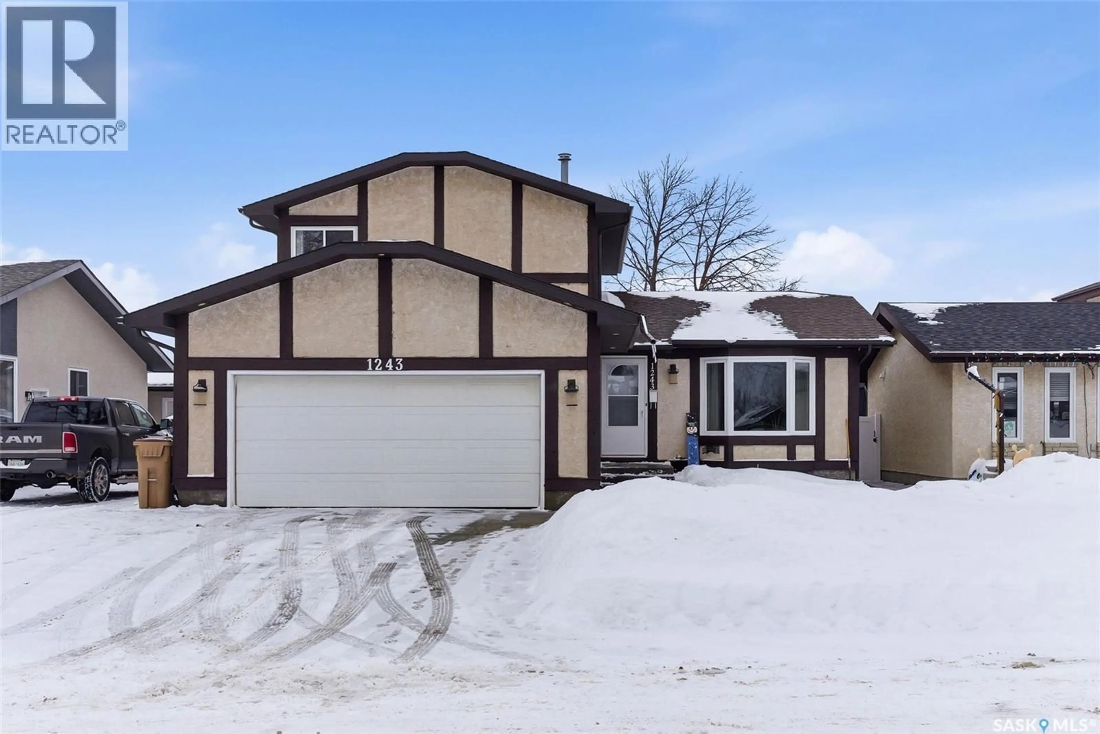Home with vinyl exterior material, street for 1243 JAMES CRESCENT, Regina Saskatchewan S4N6A4