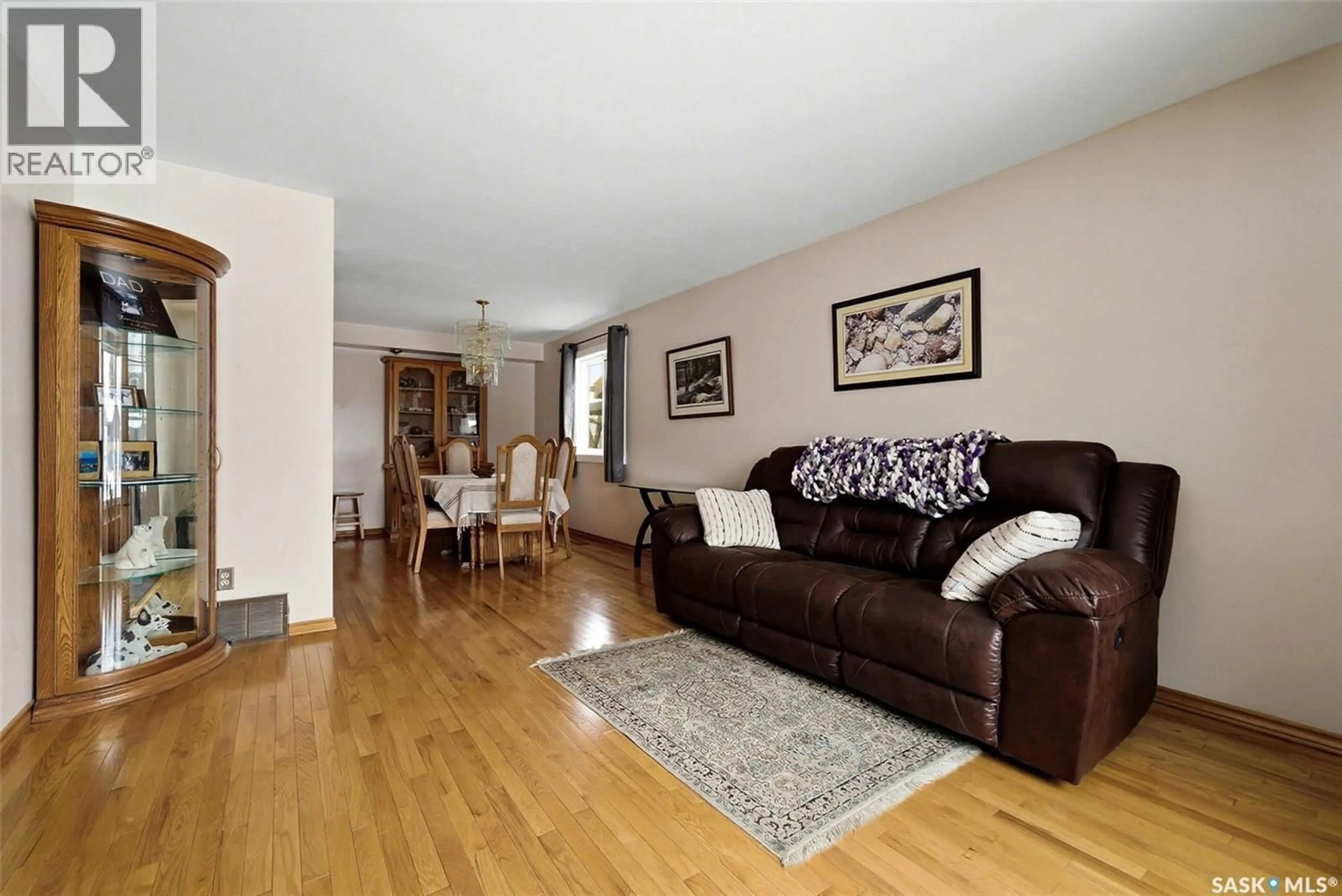 Living room with furniture, wood/laminate floor for 1243 JAMES CRESCENT, Regina Saskatchewan S4N6A4