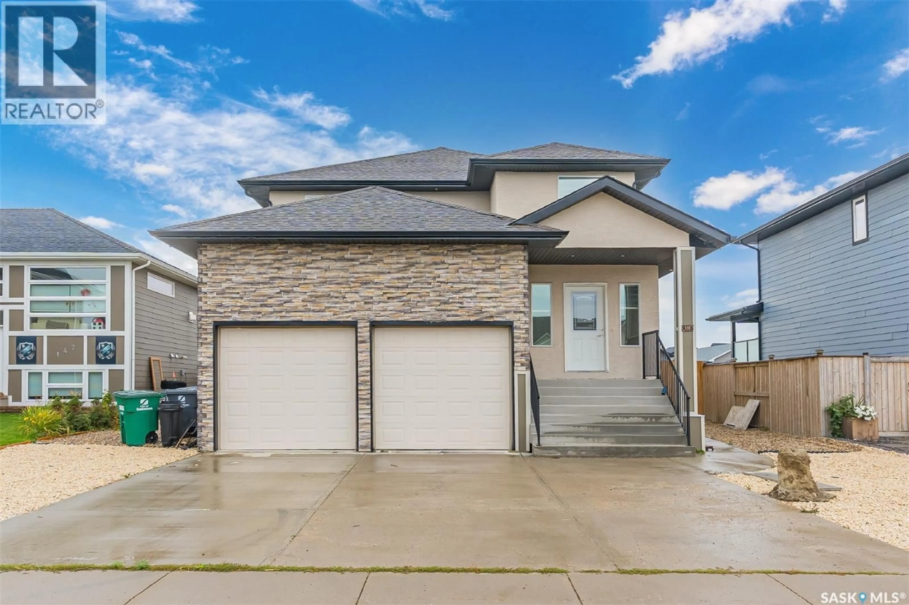 Home with vinyl exterior material, street for 145 JOHNS ROAD, Saskatoon Saskatchewan S7W0L2