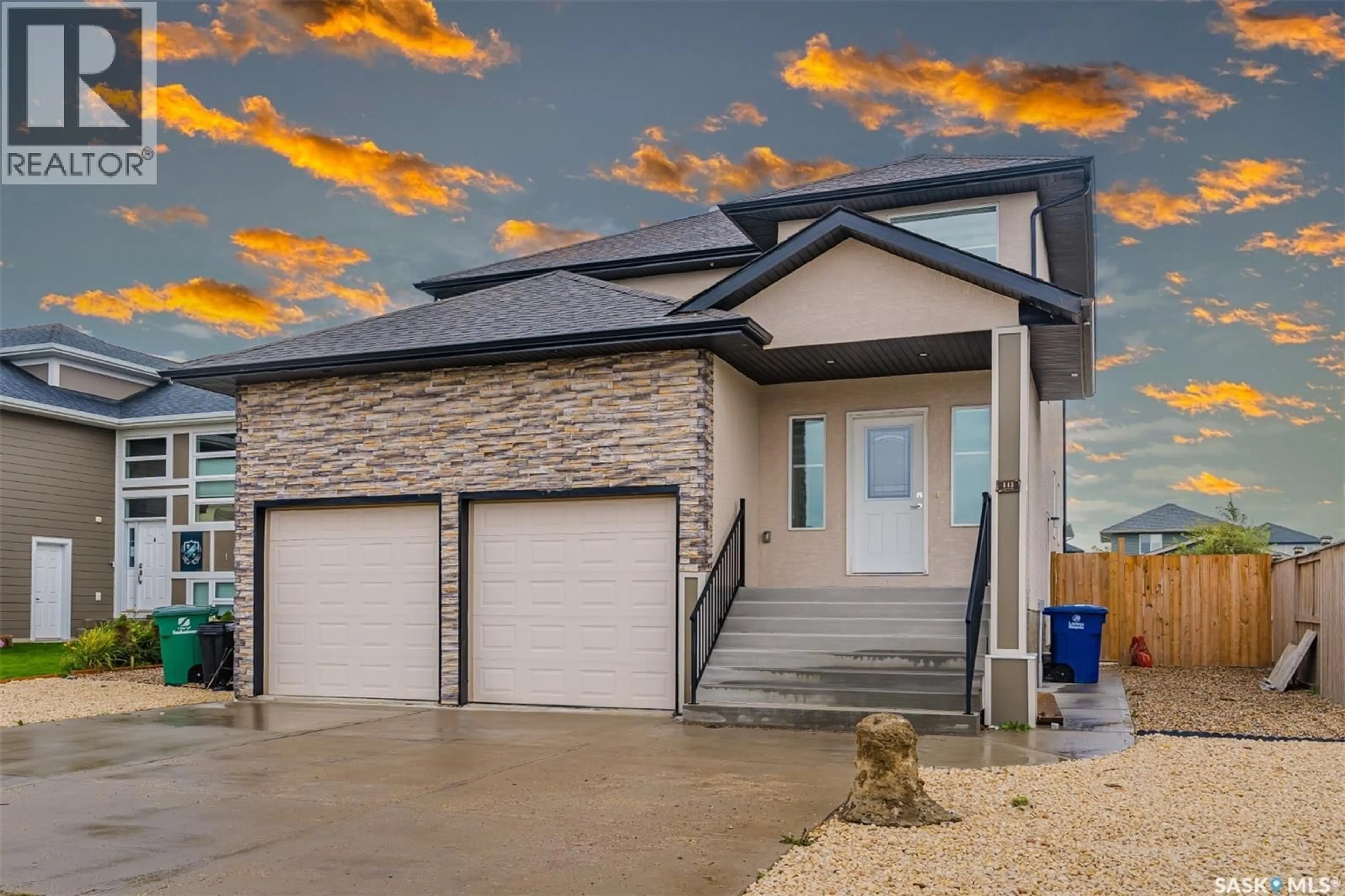 Home with vinyl exterior material, street for 145 JOHNS ROAD, Saskatoon Saskatchewan S7W0L2
