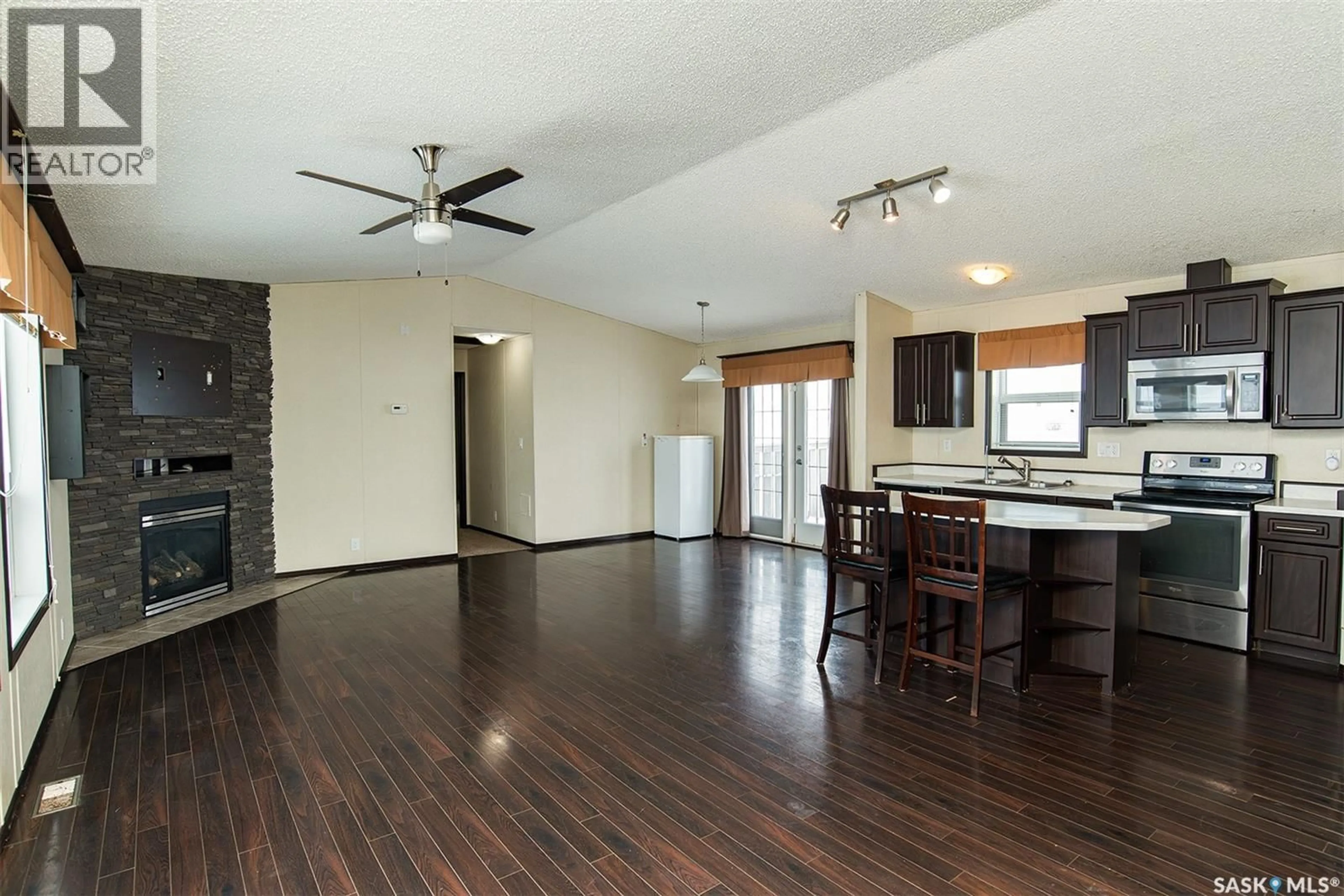 Open concept kitchen, wood/laminate floor for SHORT ACREAGE, Big Quill Rm No. 308 Saskatchewan S0A4T0