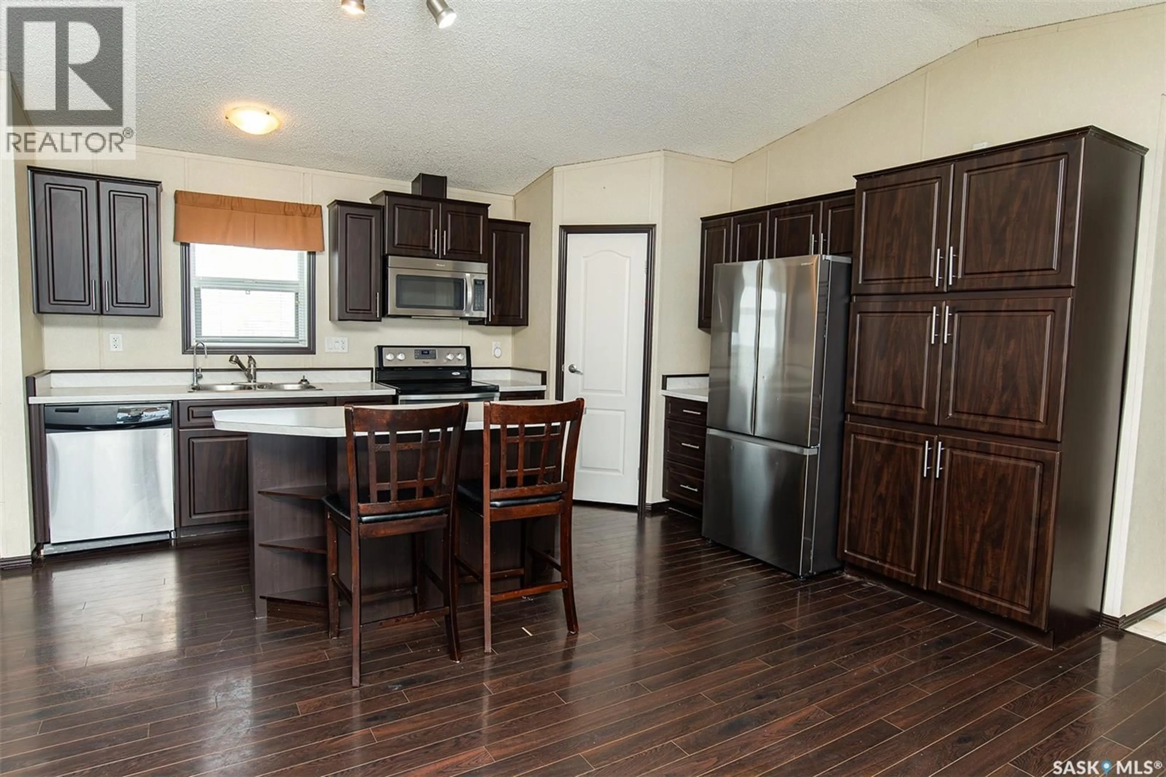 Open concept kitchen, wood/laminate floor for SHORT ACREAGE, Big Quill Rm No. 308 Saskatchewan S0A4T0
