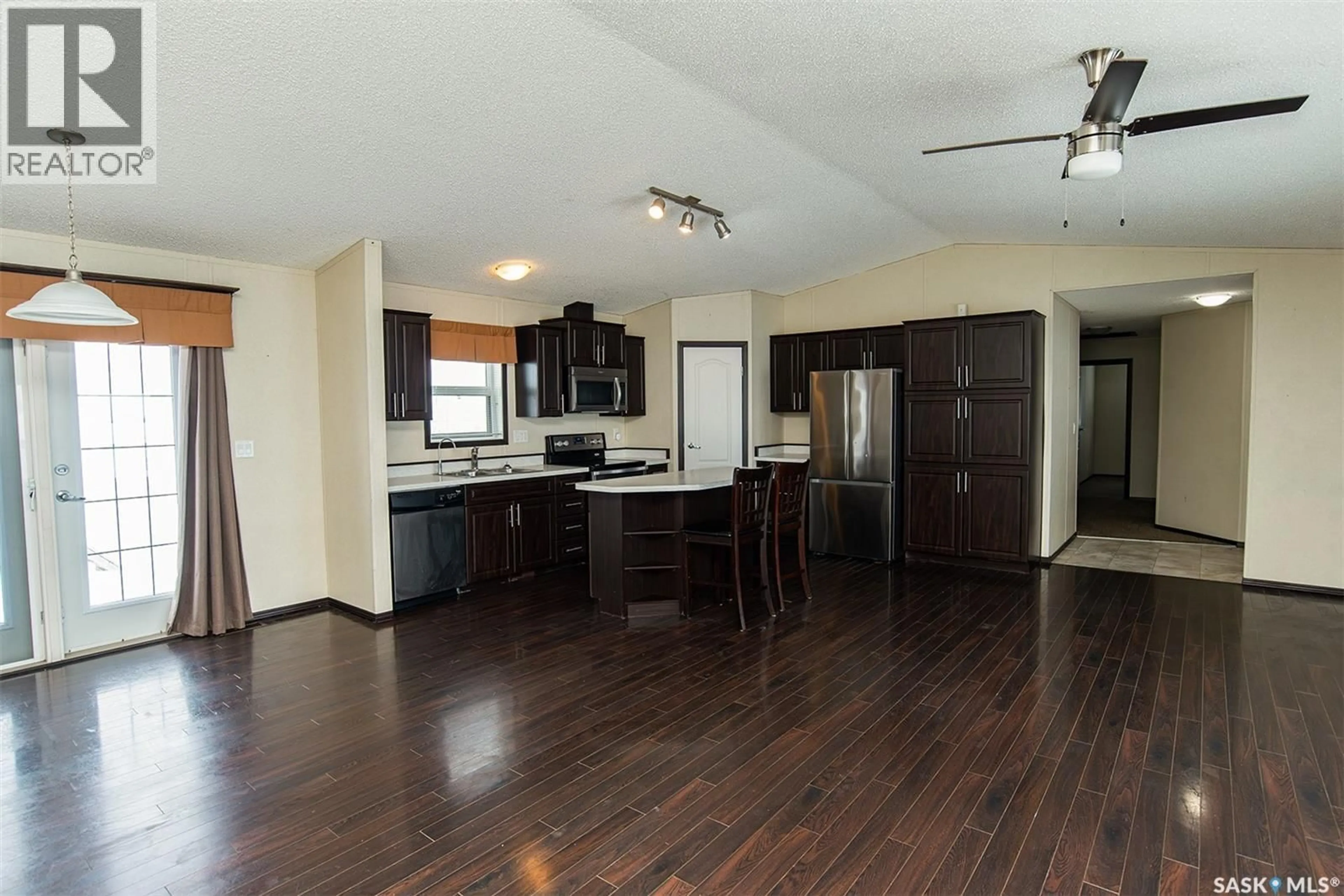 Open concept kitchen, wood/laminate floor for SHORT ACREAGE, Big Quill Rm No. 308 Saskatchewan S0A4T0