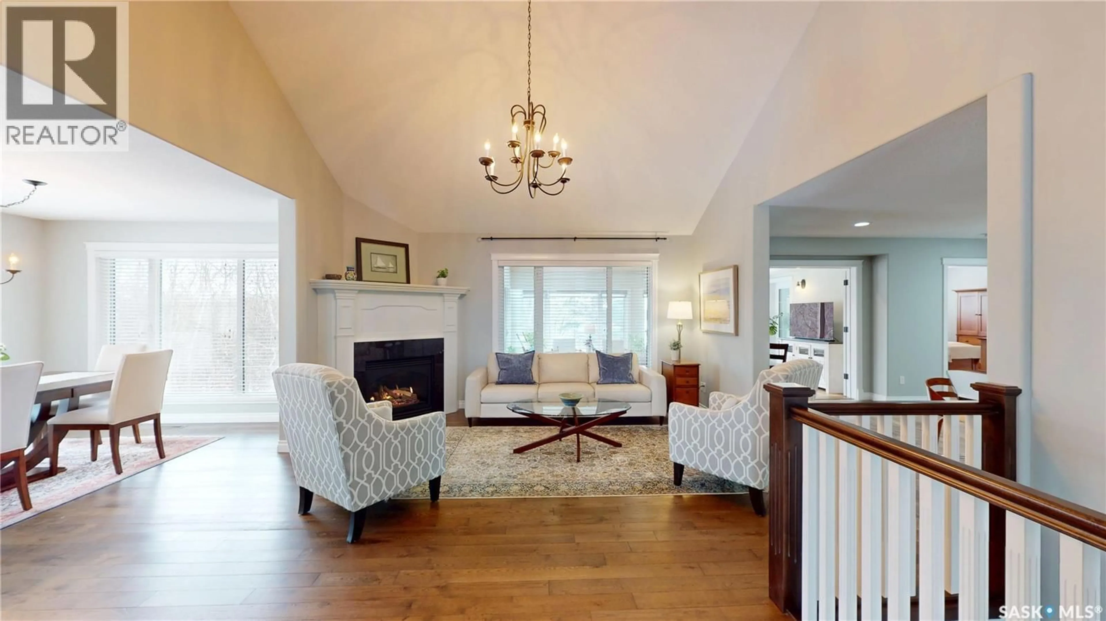 Living room with furniture, wood/laminate floor for 116 MAPLE ROAD, Aberdeen Rm No. 373 Saskatchewan S7A0A4