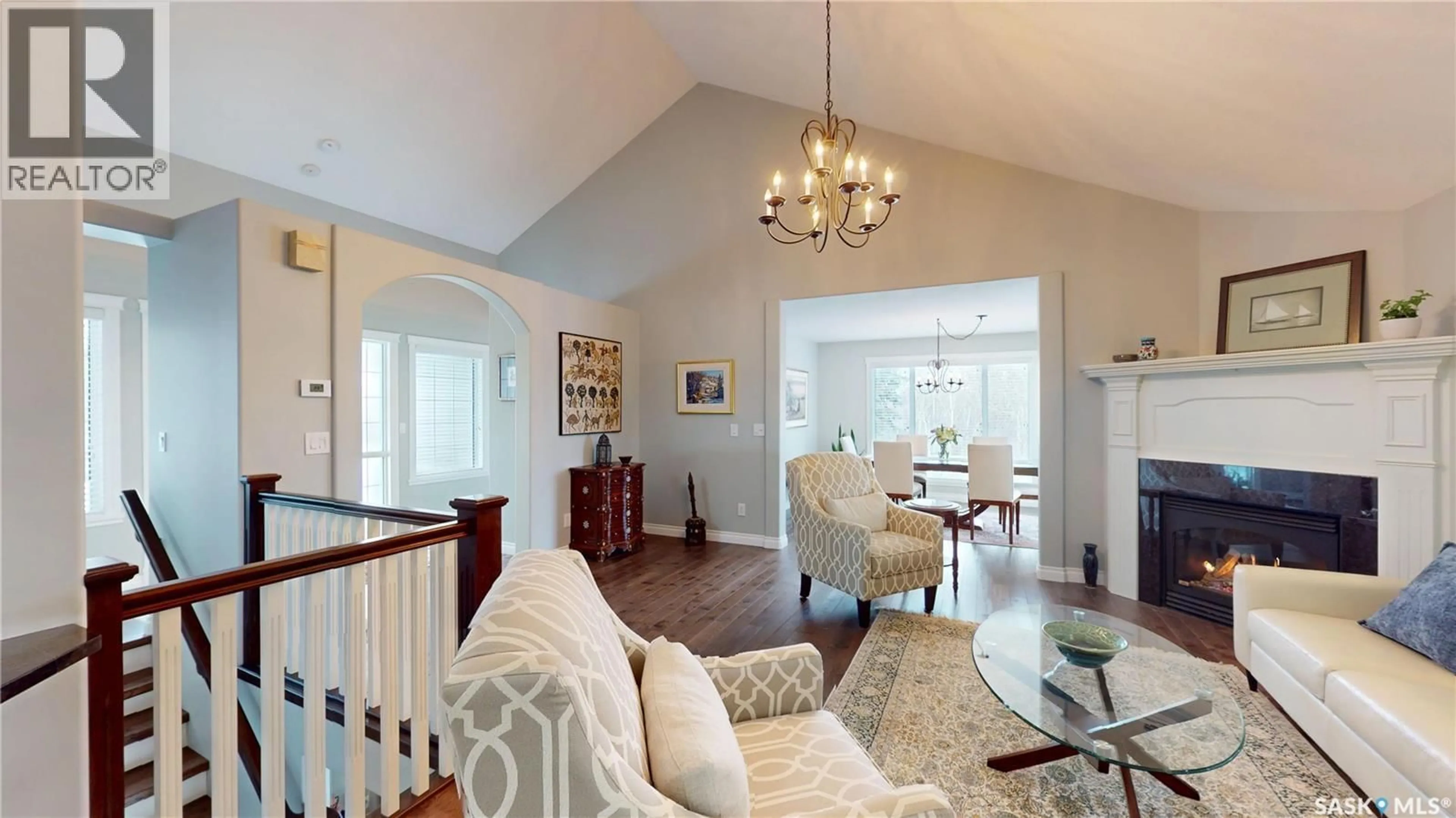 Living room with furniture, wood/laminate floor for 116 MAPLE ROAD, Aberdeen Rm No. 373 Saskatchewan S7A0A4