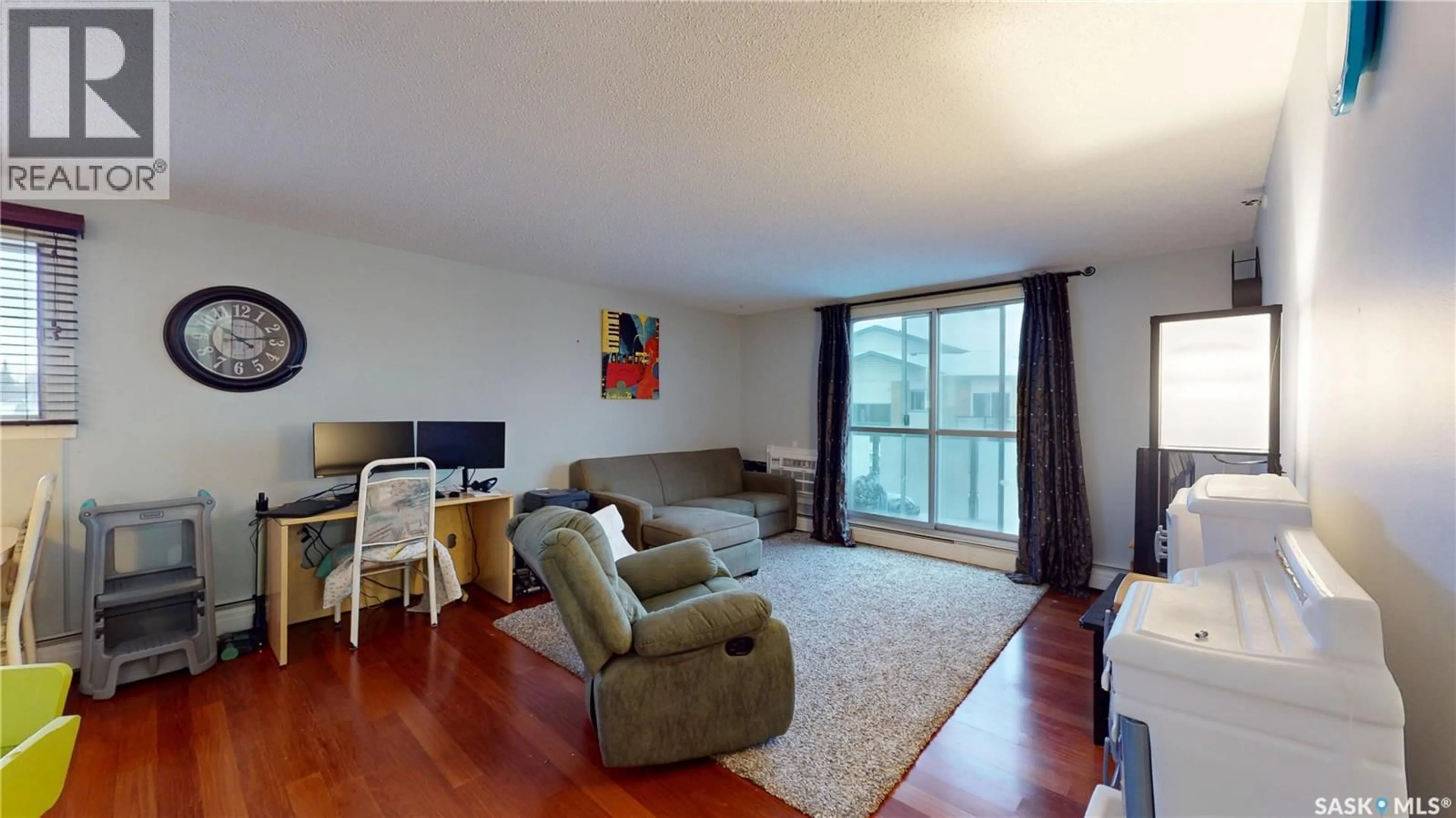 Living room with furniture, wood/laminate floor for 27 111 ST LAWRENCE CRESCENT, Saskatoon Saskatchewan S7K1G7