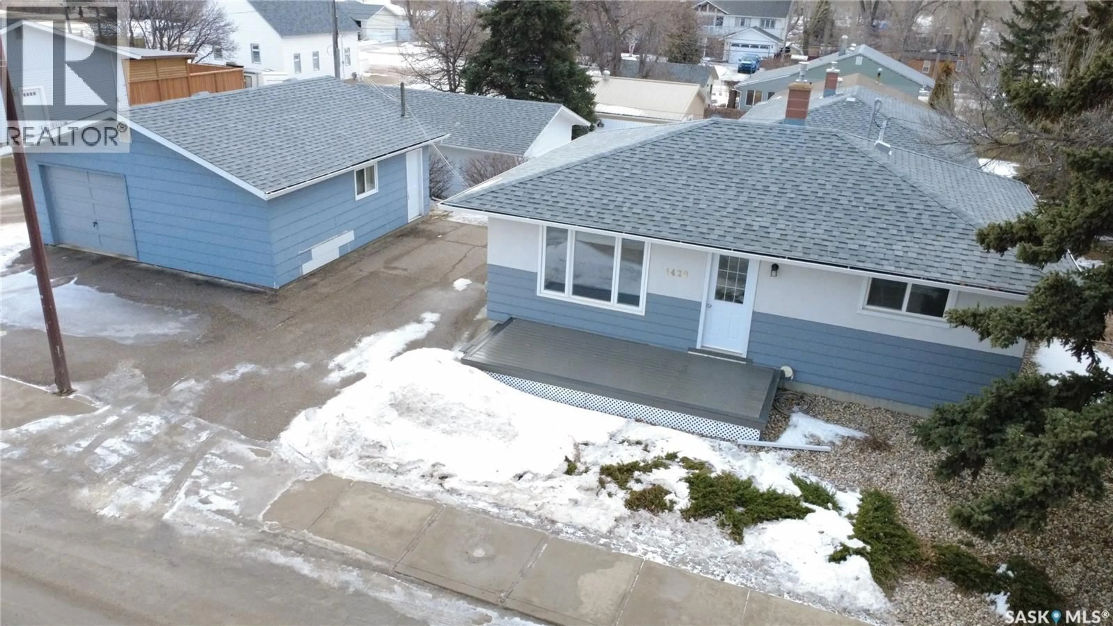 A pic from outside/outdoor area/front of a property/back of a property/a pic from drone, street for E - 1420 CHAPLIN STREET, Swift Current Saskatchewan S9H1K4