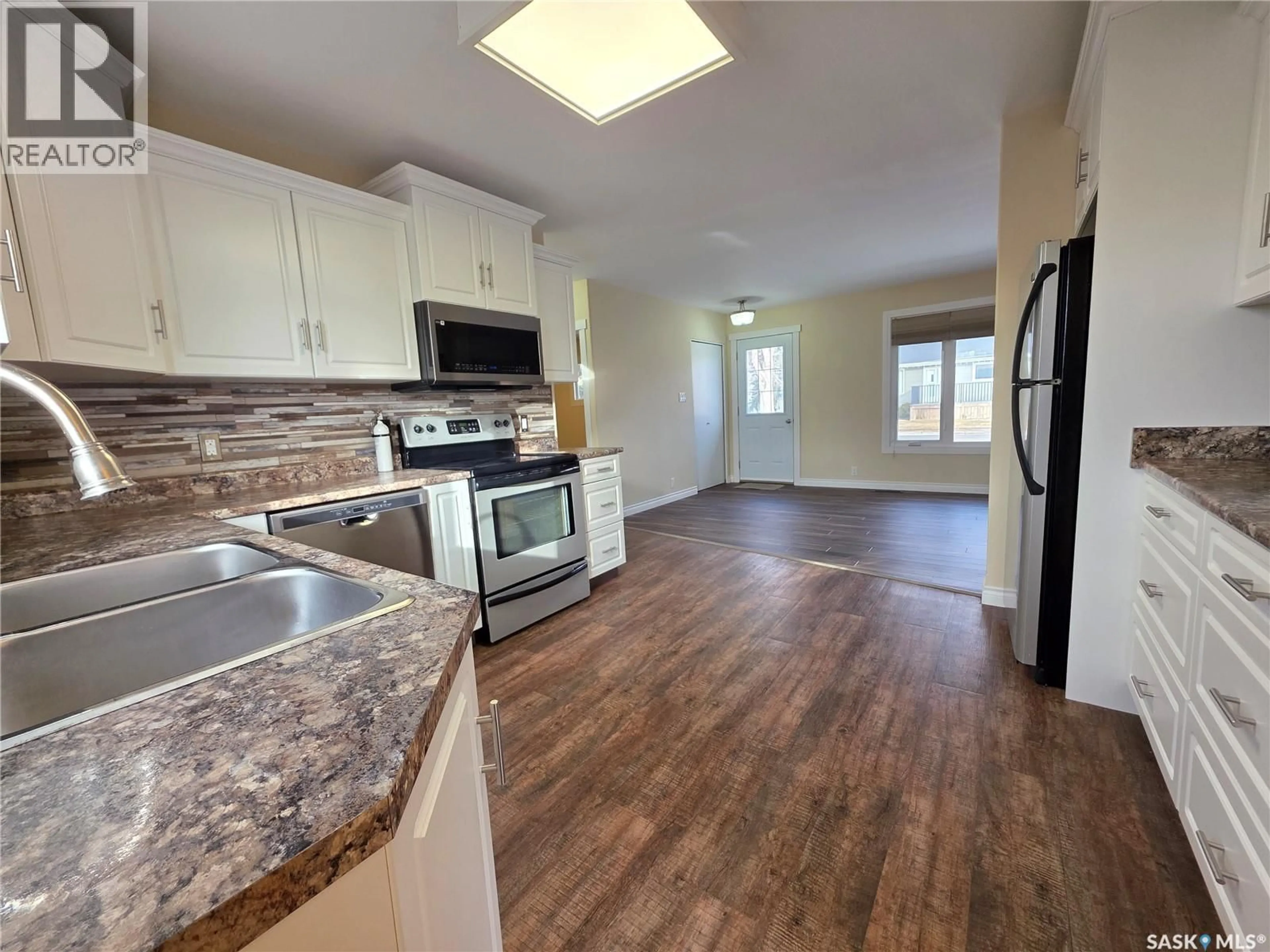Open concept kitchen, ceramic/tile floor for E - 1420 CHAPLIN STREET, Swift Current Saskatchewan S9H1K4