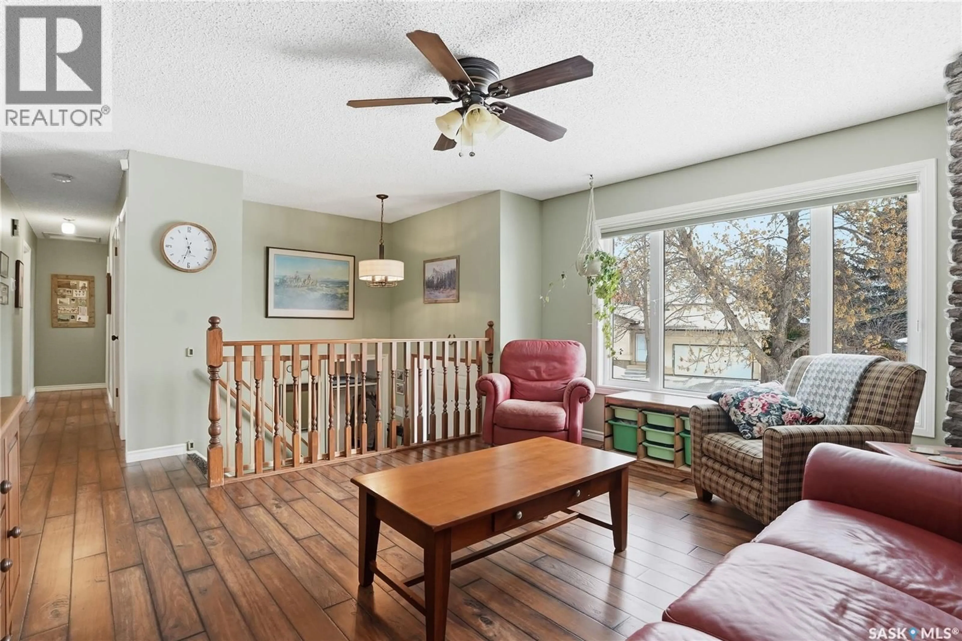 Living room with furniture, wood/laminate floor for 1714 BRADWELL AVENUE, Saskatoon Saskatchewan S7N2W1