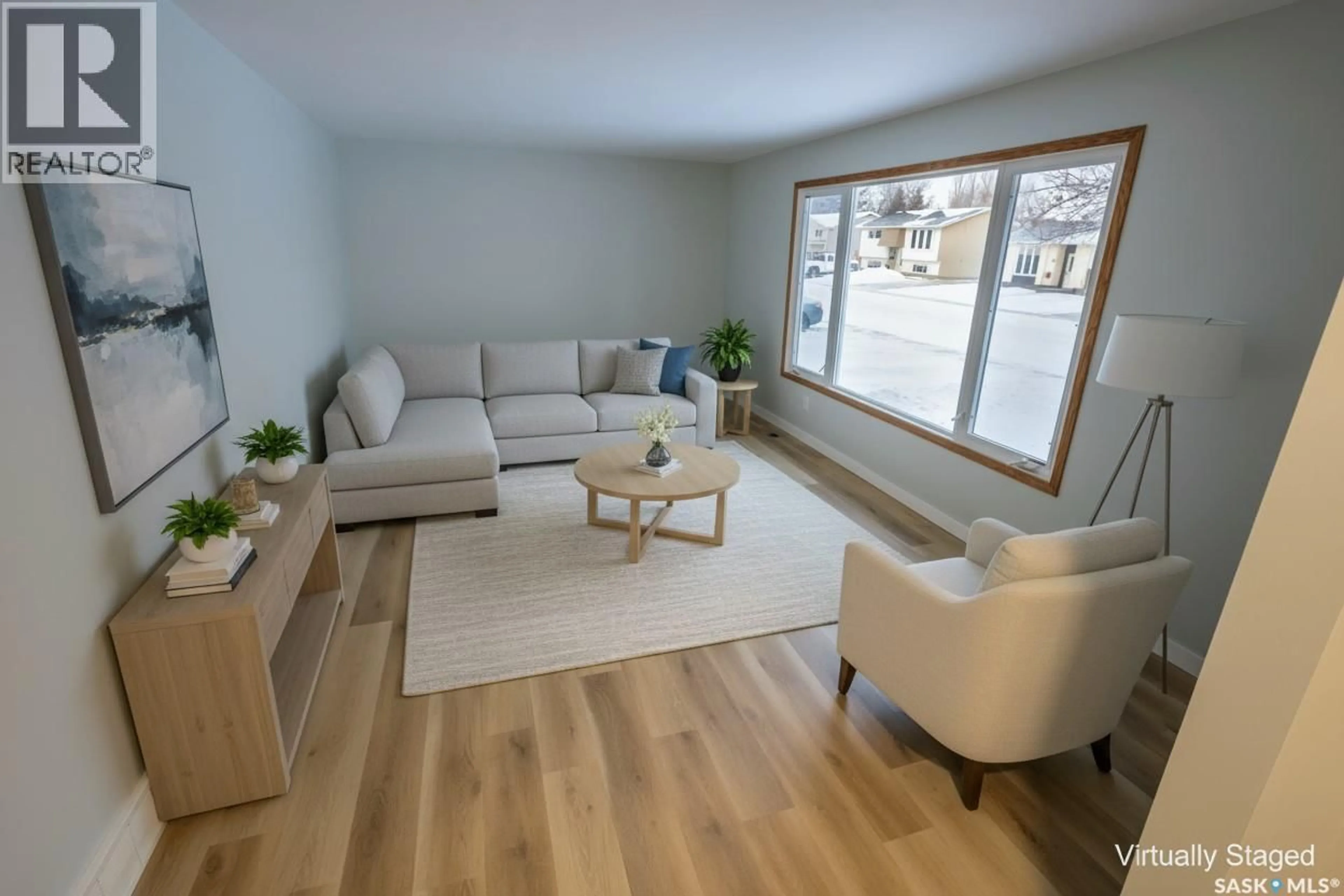 Living room with furniture, wood/laminate floor for 54 BUTTERCUP CRESCENT, Moose Jaw Saskatchewan S6J1A4