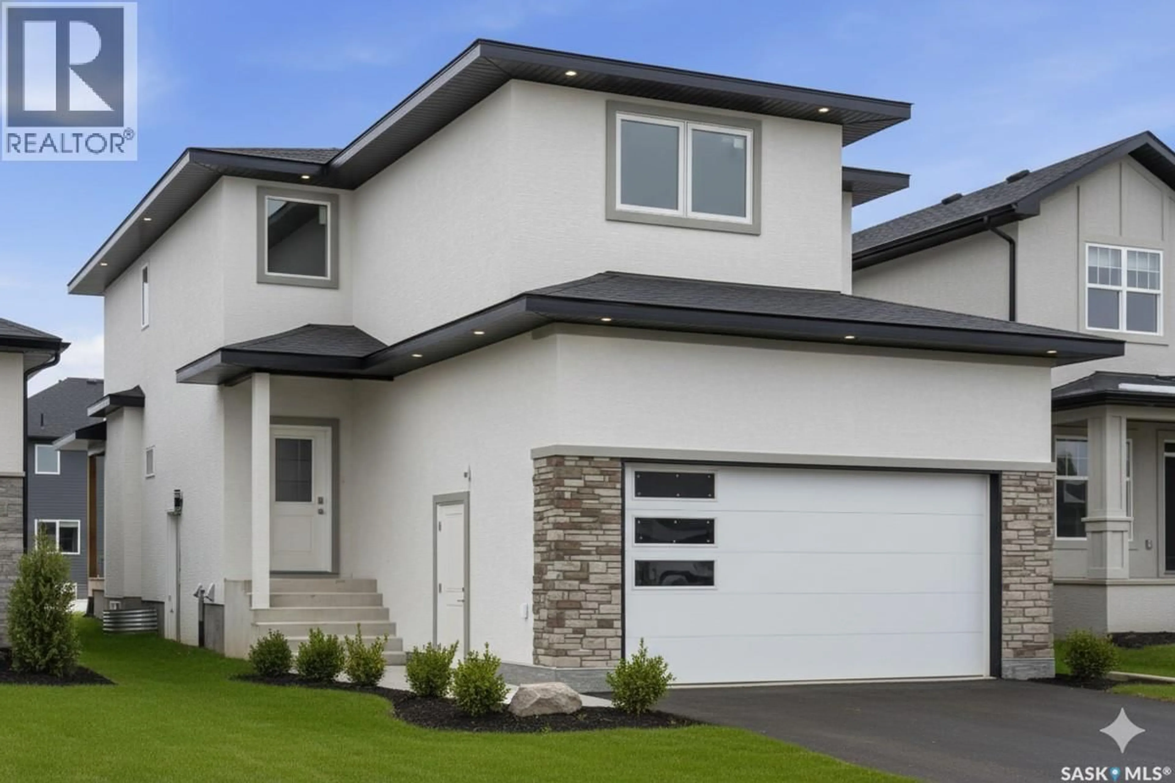 Home with vinyl exterior material, street for 707 NAZARALI WAY, Saskatoon Saskatchewan S7V1X4