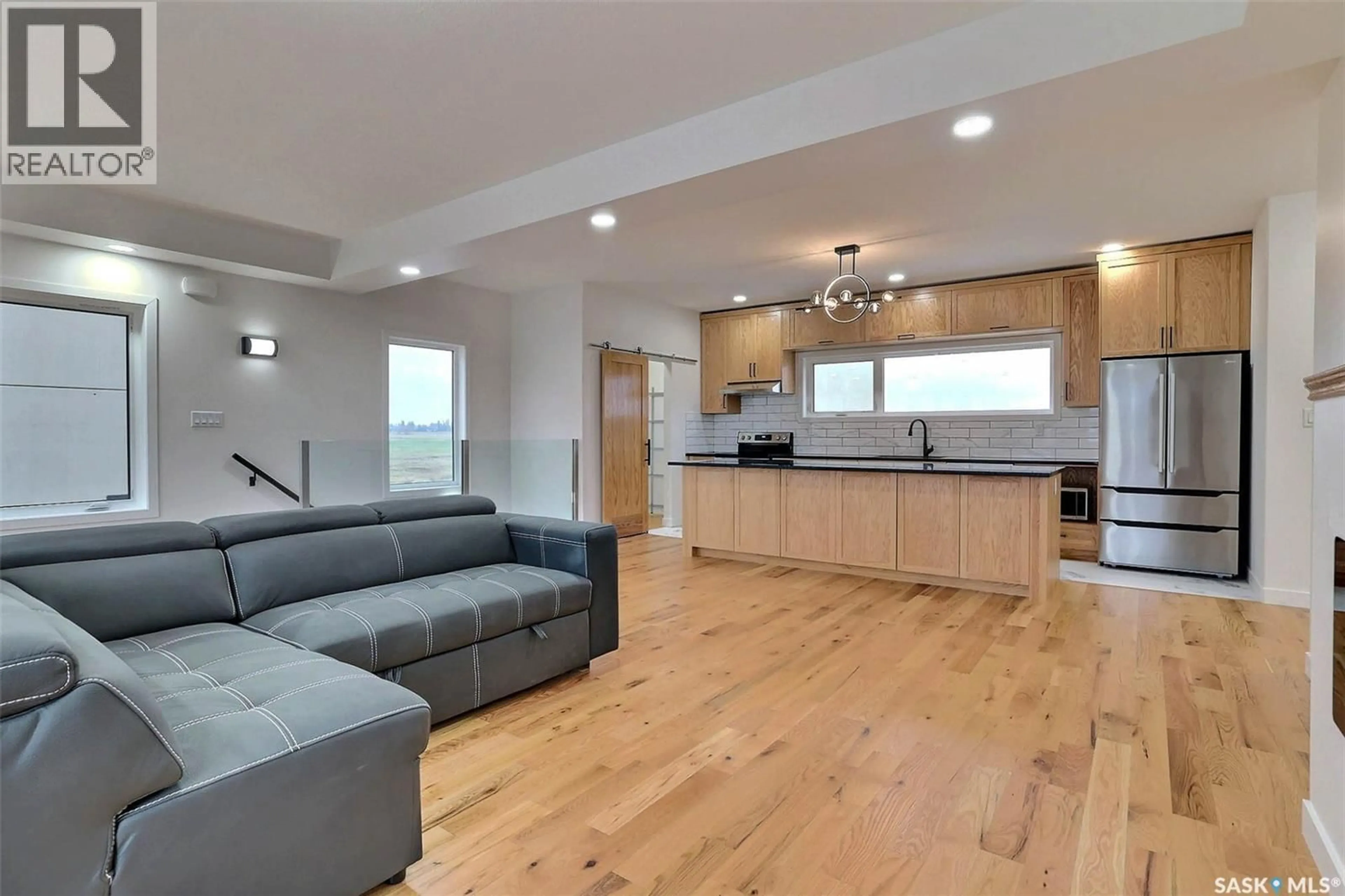 Open concept kitchen, wood/laminate floor for 716 EMERALD PARK ROAD, Edenwold Rm No.158 Saskatchewan S4L0C4